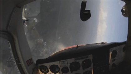 In the classic base-to-final spin entry, the lower wing stalls first and the aircraft is upside down immediately. No one should see this view turning onto the final approach segment.
