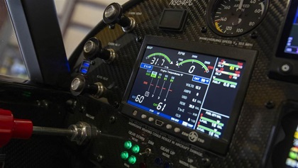 Four green lights on the instrument panel indicate the gear is down for a runway landing.