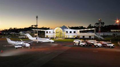 Bent Wing Flight Services FBO is in a building shaped like an airplane.