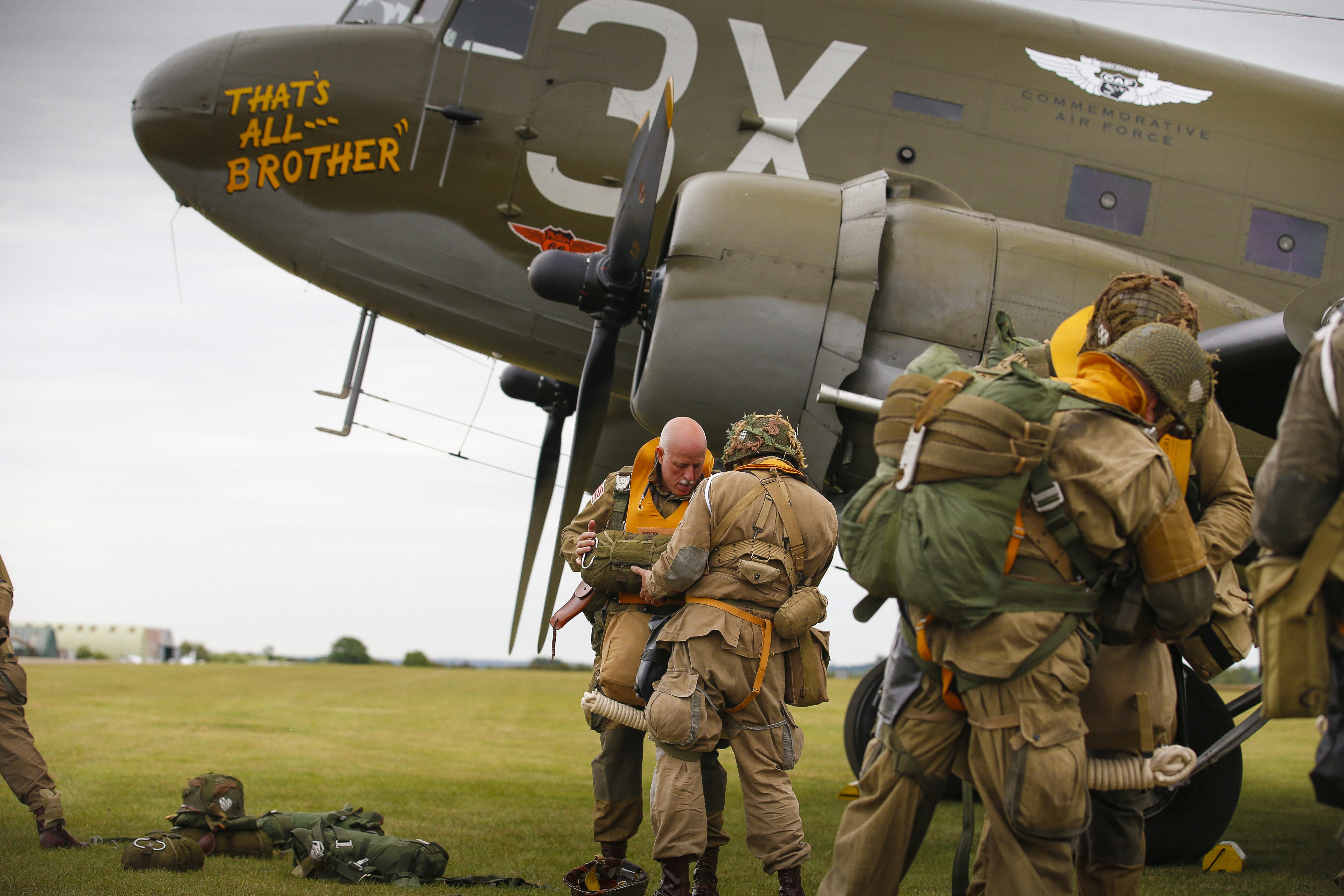 Jump preparations next to 'That’s All, Brother', the C-47 that led the formation of airplanes on D-Day and again 75 years later.
