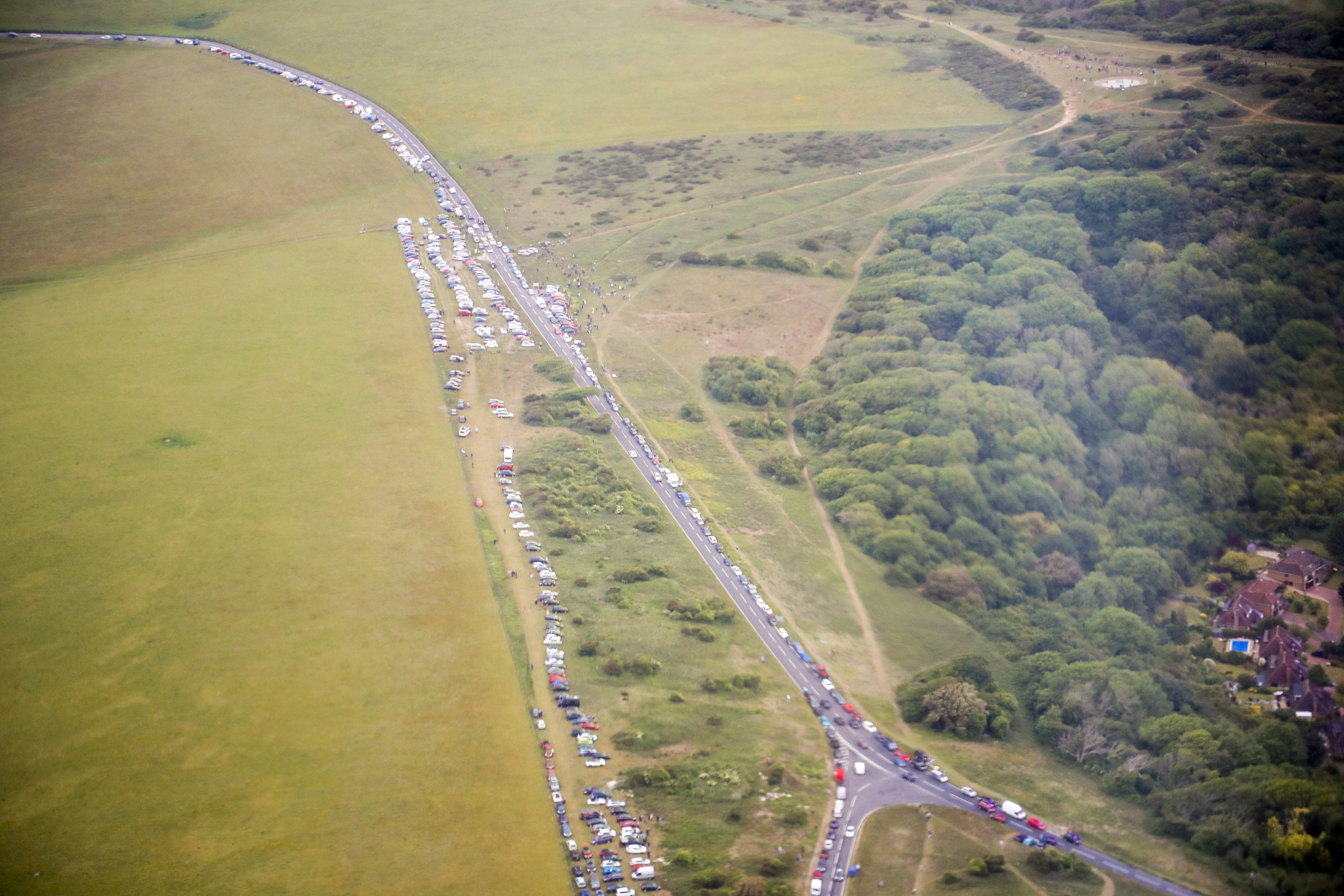 Thousands of commuters stopped on highways to watch the largest formation of DC-3s and C-47s fly over England since the war.