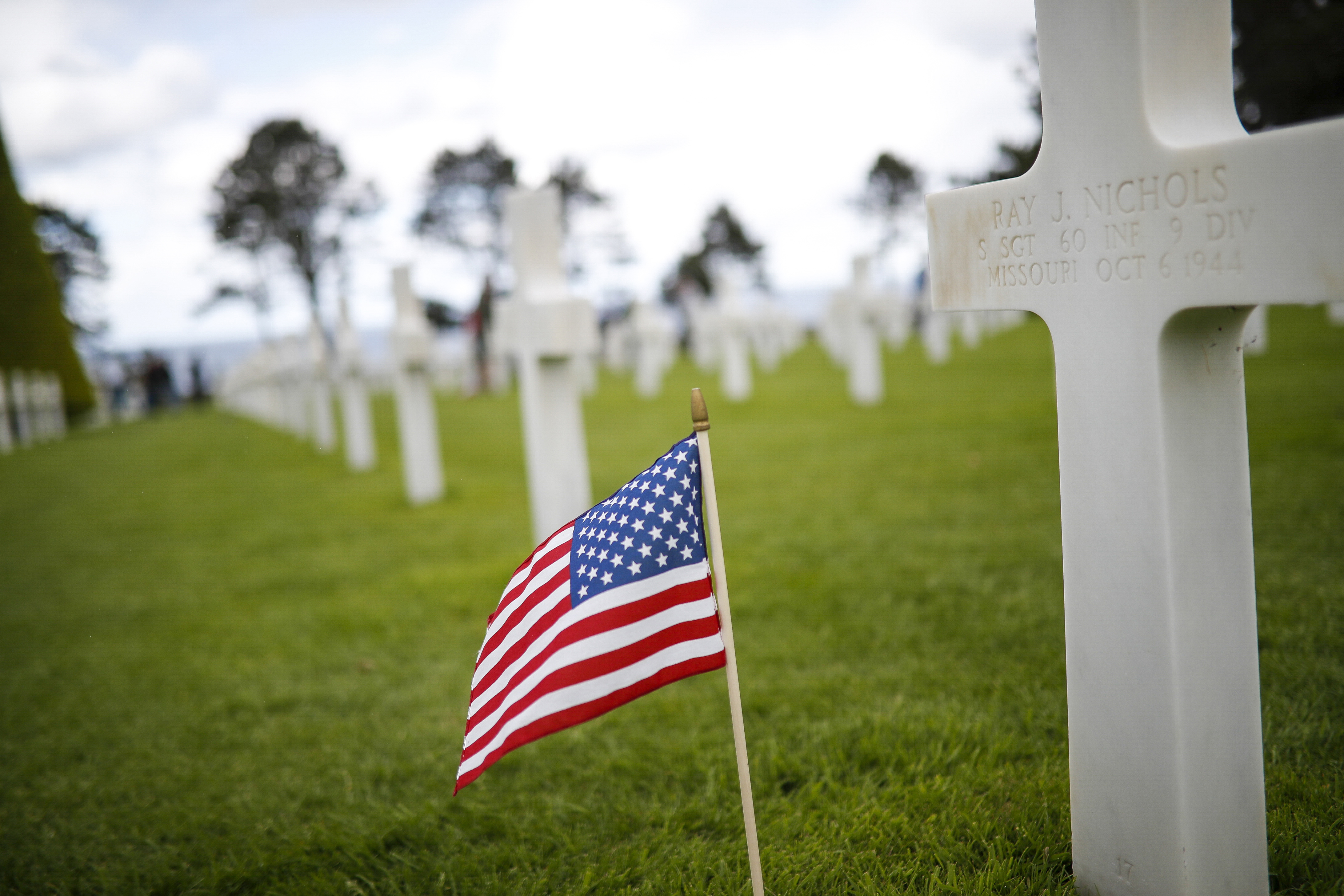 A somber sky arcs over the resting place for nearly 10,000 Americans in Normandy.