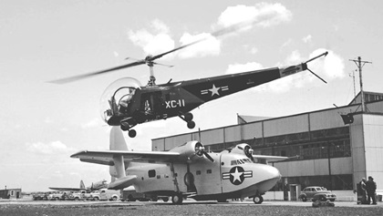 A Bell HTL–1 taking off over a Grumman Albatross prototype at Floyd Bennett Field (May 1948).