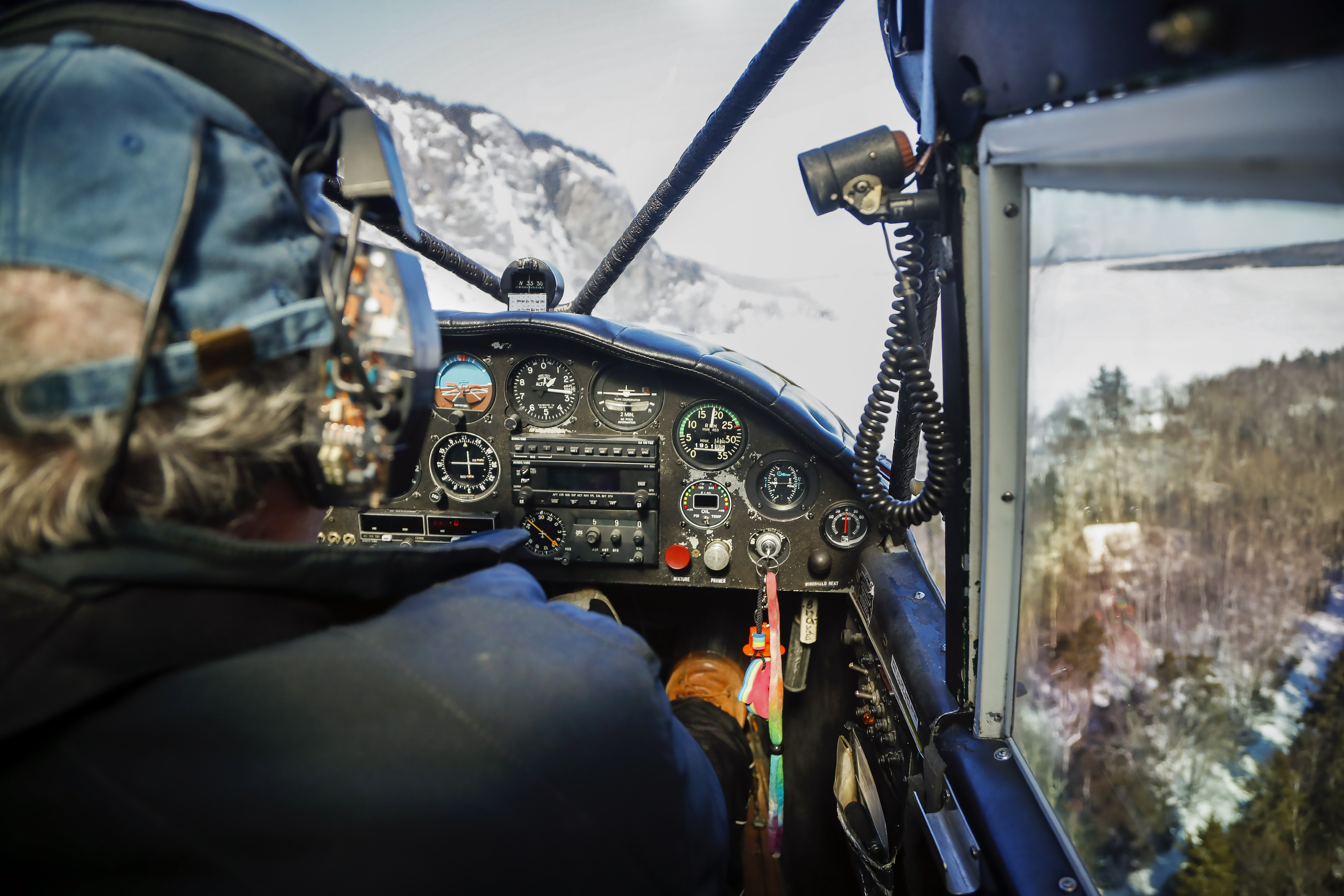 Mount Kineo in central Maine looms large through the windshield of a Piper PA–12 as it maneuvers to land on a nearby snowfield. Winter flying requires extra planning and effort—but the rewards can be spectacular.