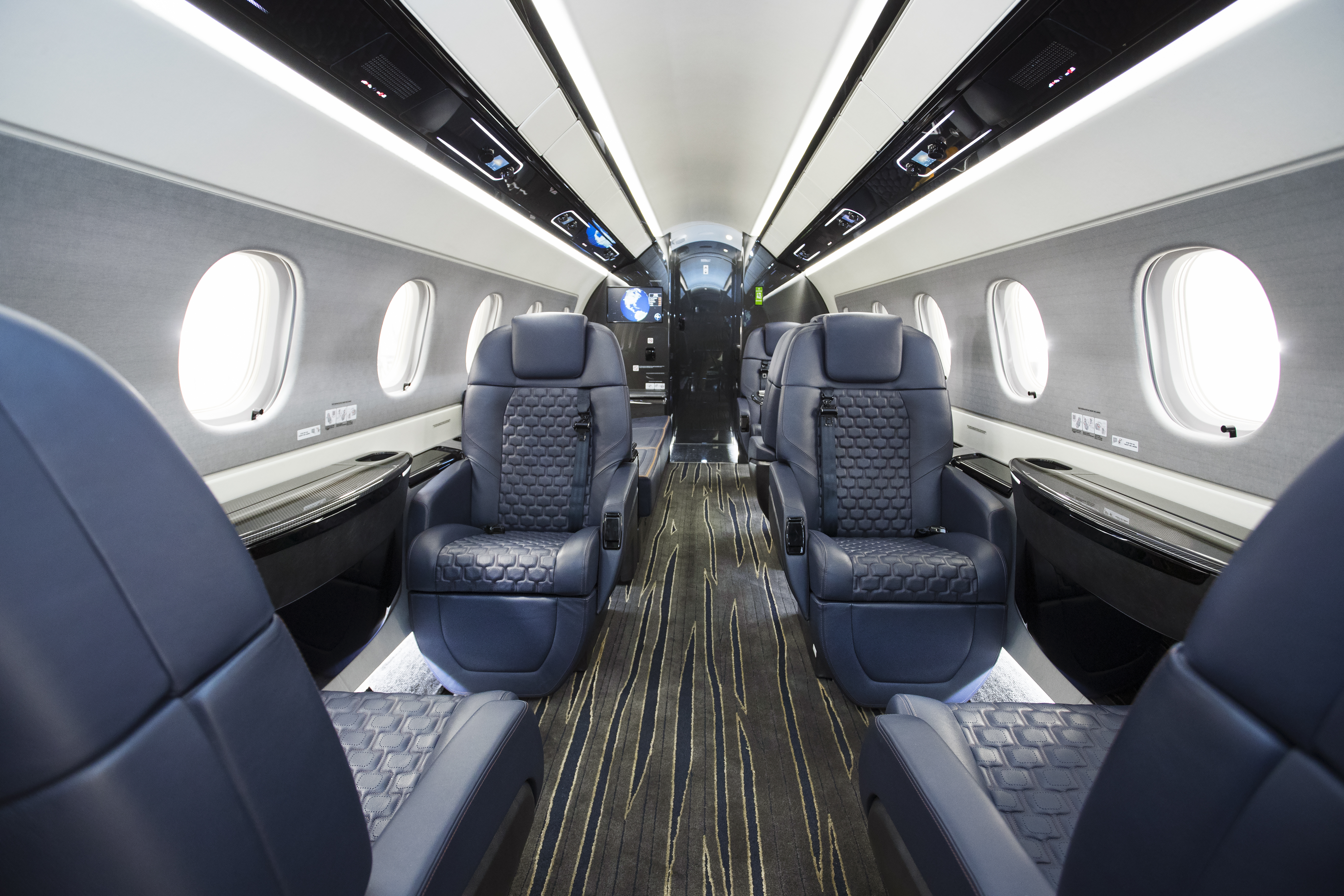 The swanky “Bossa Nova” interior is a popular $750,000 option. This configuration has forward club seats, two aft seats, a three-place side-facing divan, and a belted potty in the aft lavatory—which has an airline-style vacuum-flushing, externally serviced toilet. Valences above the cabin seats feature flight-information displays and lighting controls. Telephones and dimming switches are in discreet sidewall-mounted compartments.