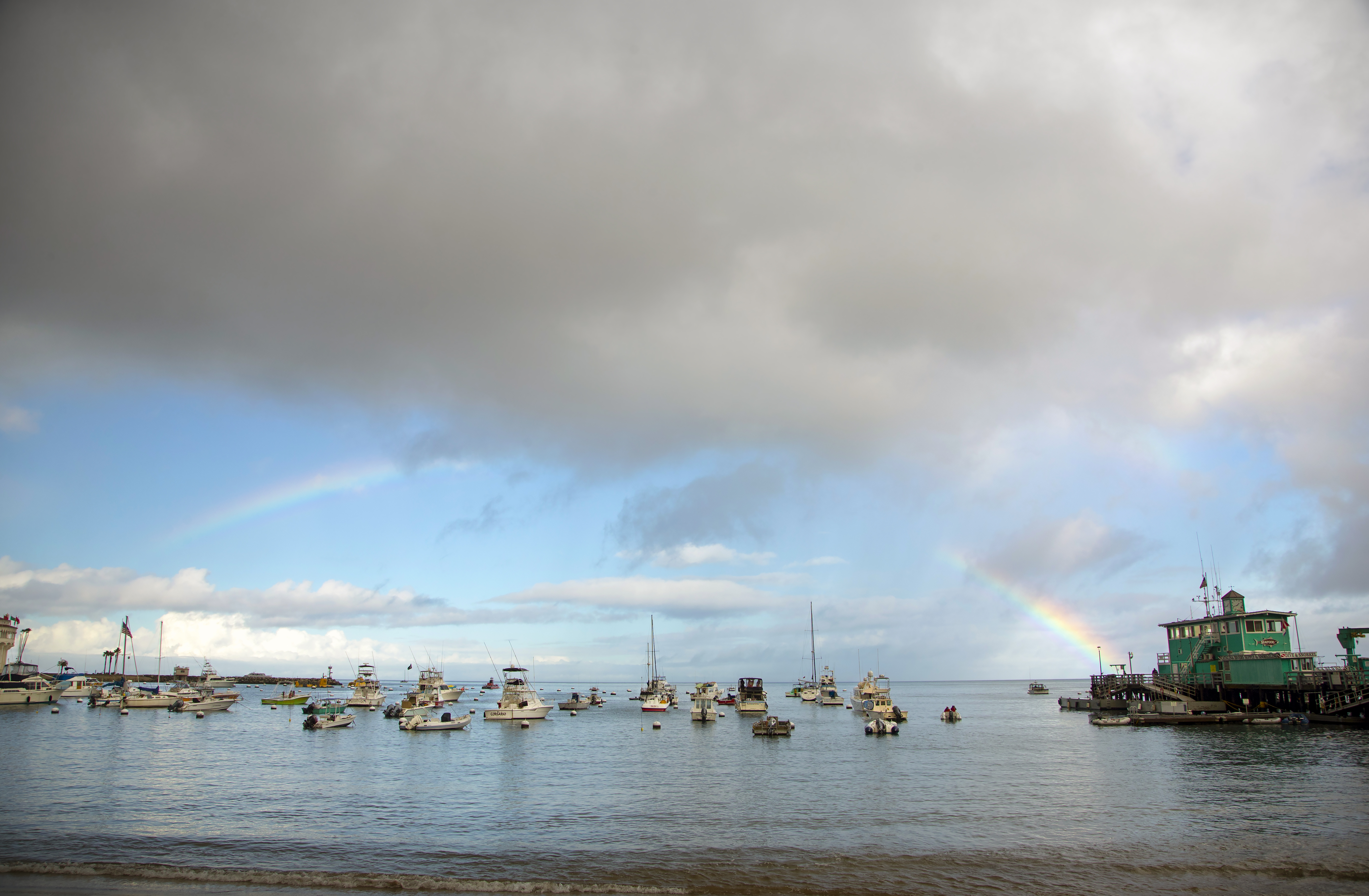 A rainbow arcs across the bay. 