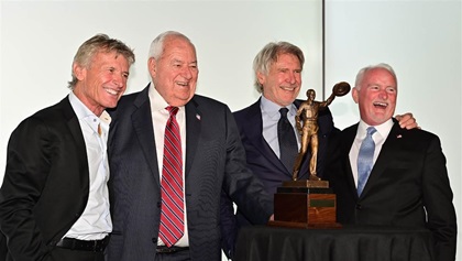 Past recipients of the Hoover Trophy Sean D. Tucker, Clay Lacy, and Harrison Ford with AOPA President Mark Baker, seen here at the award ceremony in March 2019.