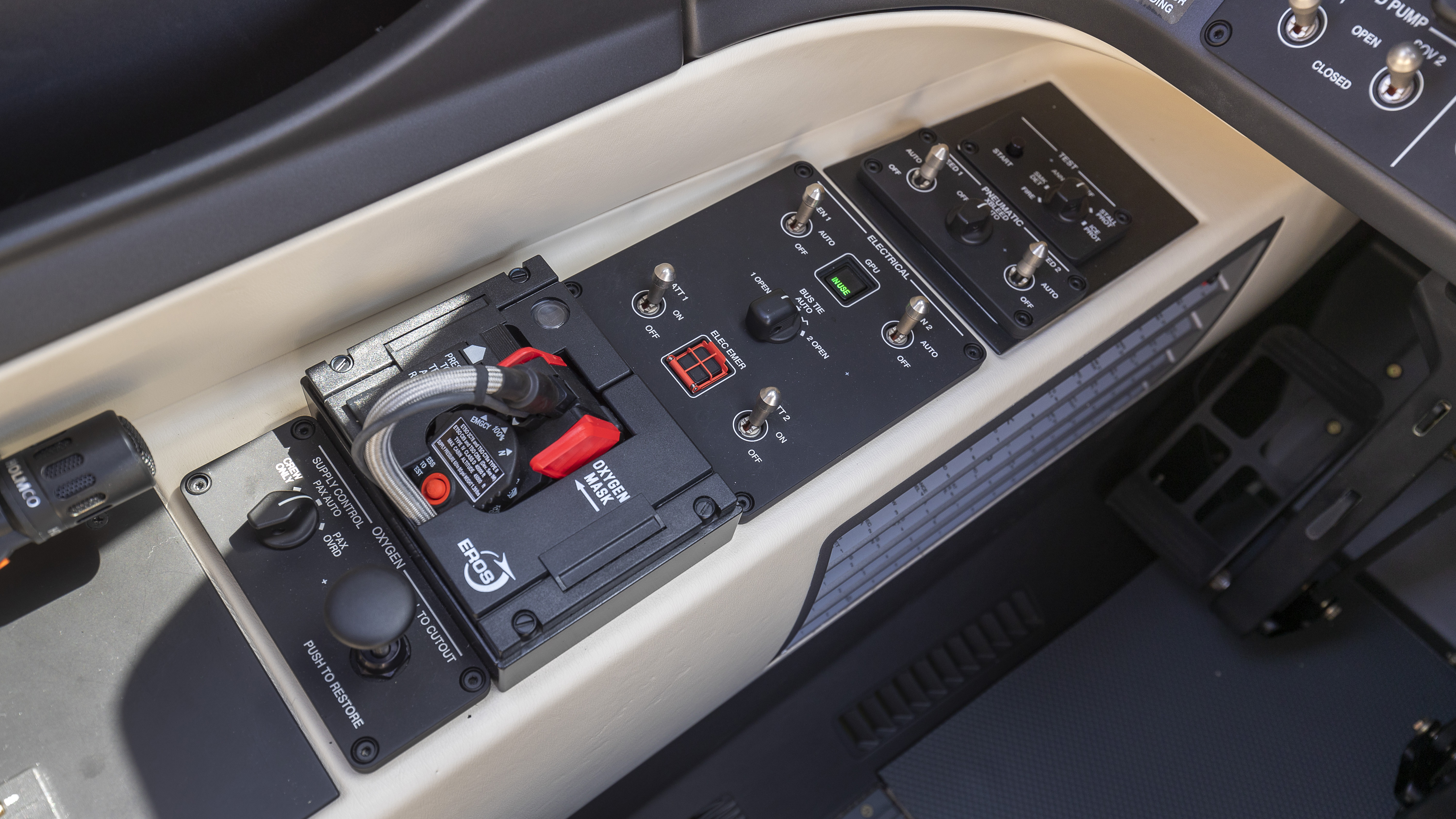 The left side panel controls are simple and uncluttered. From front to back, they are: annunciator test, bleed air, generator and GPU, bus tie, and battery switches, and oxygen mask and controls.