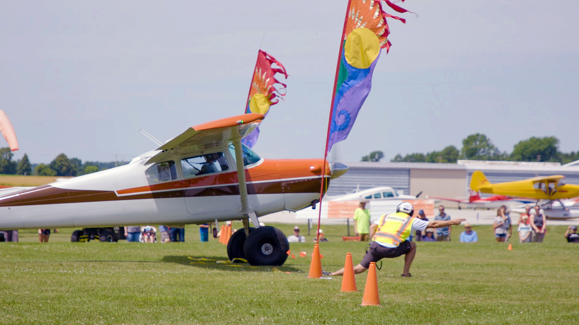 Jim Stevenson, with a few knots on the tail, gets the signal to take off in his Cessna 170B.