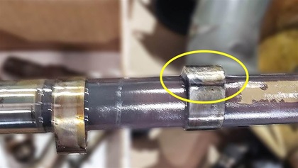 Three of the eight tappets are severely spalled (above). Severely worn cam lobe (below).