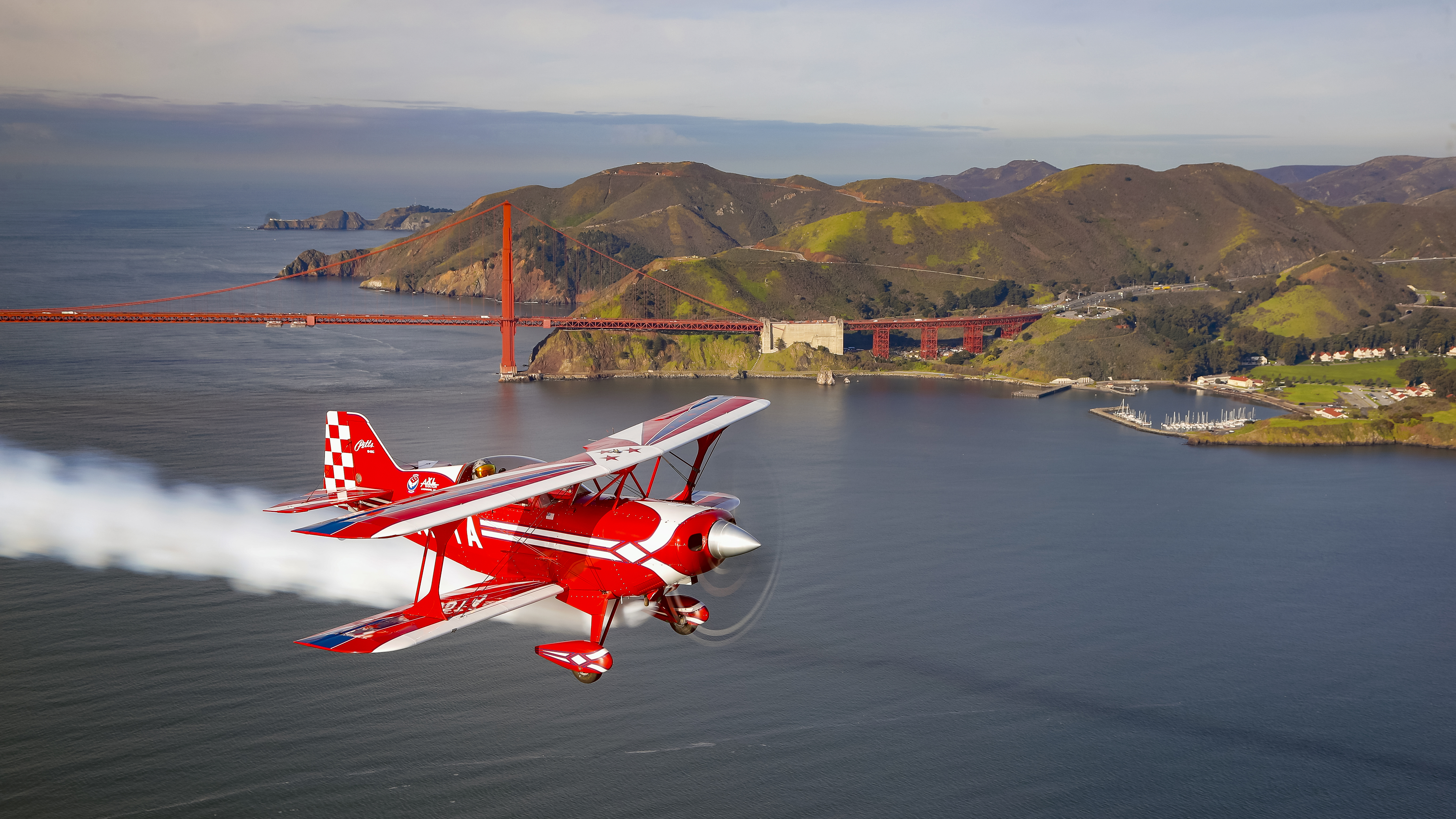 Landmarks like the Golden Gate Bridge tend to compete with airplanes for the viewer’s attention, but Chris Rose couldn’t resist using it as a backdrop to this Pitts S-2C—and since the biplane has a smoke system, why not use it?