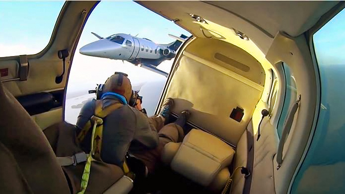 ...in the fast-moving zone of totality over southern Illinois. Rose blasted Whyte with a powerful strobe to illuminate the jet during a 90-minute flight...