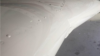 A chunk of money, a few weeks, a new leading edge skin, paint, expertise, and a lot of man-hours later, the wing looks as good as it ever did.