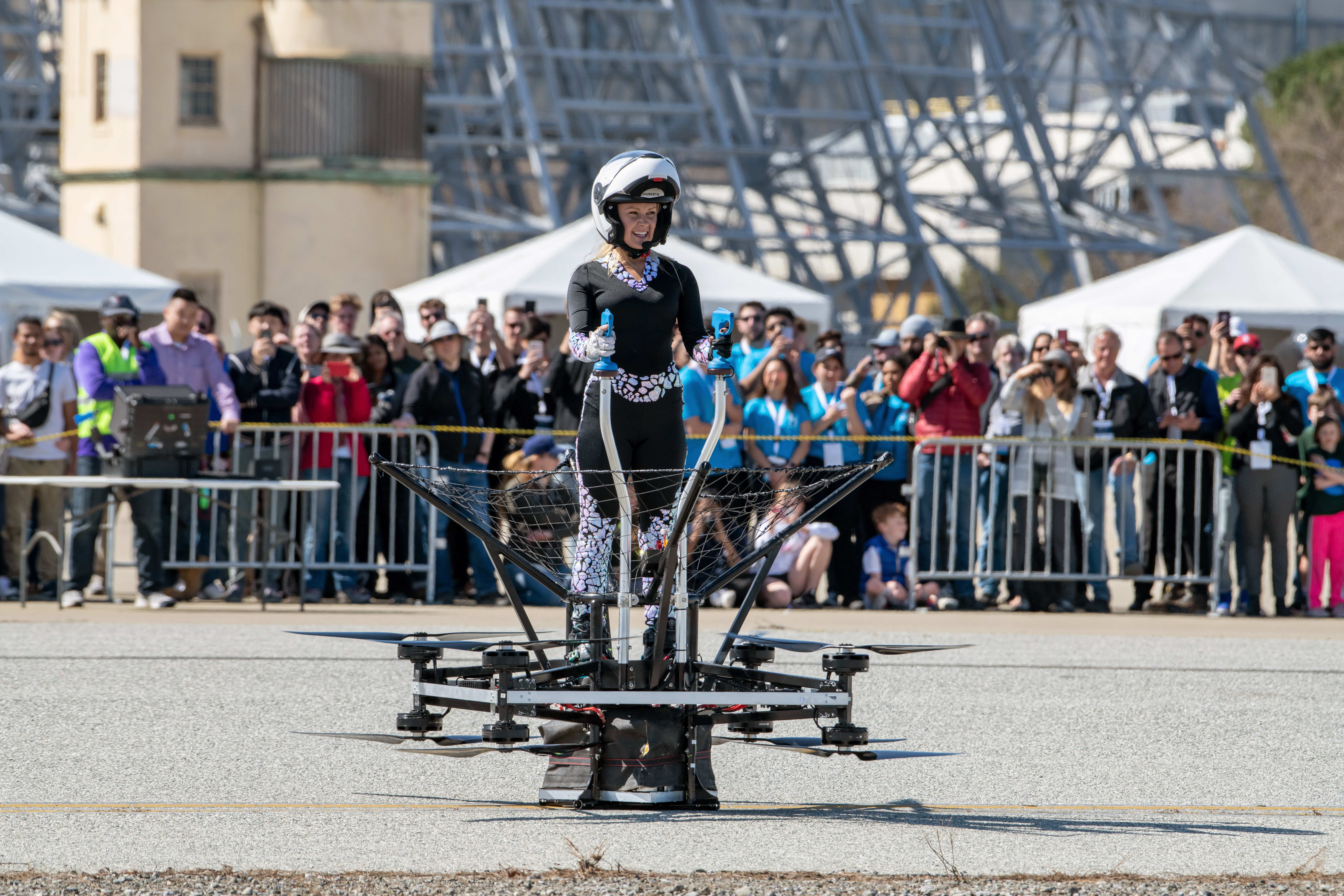 Mariah Cain stands in the flying position of the DragonAir Airboard.