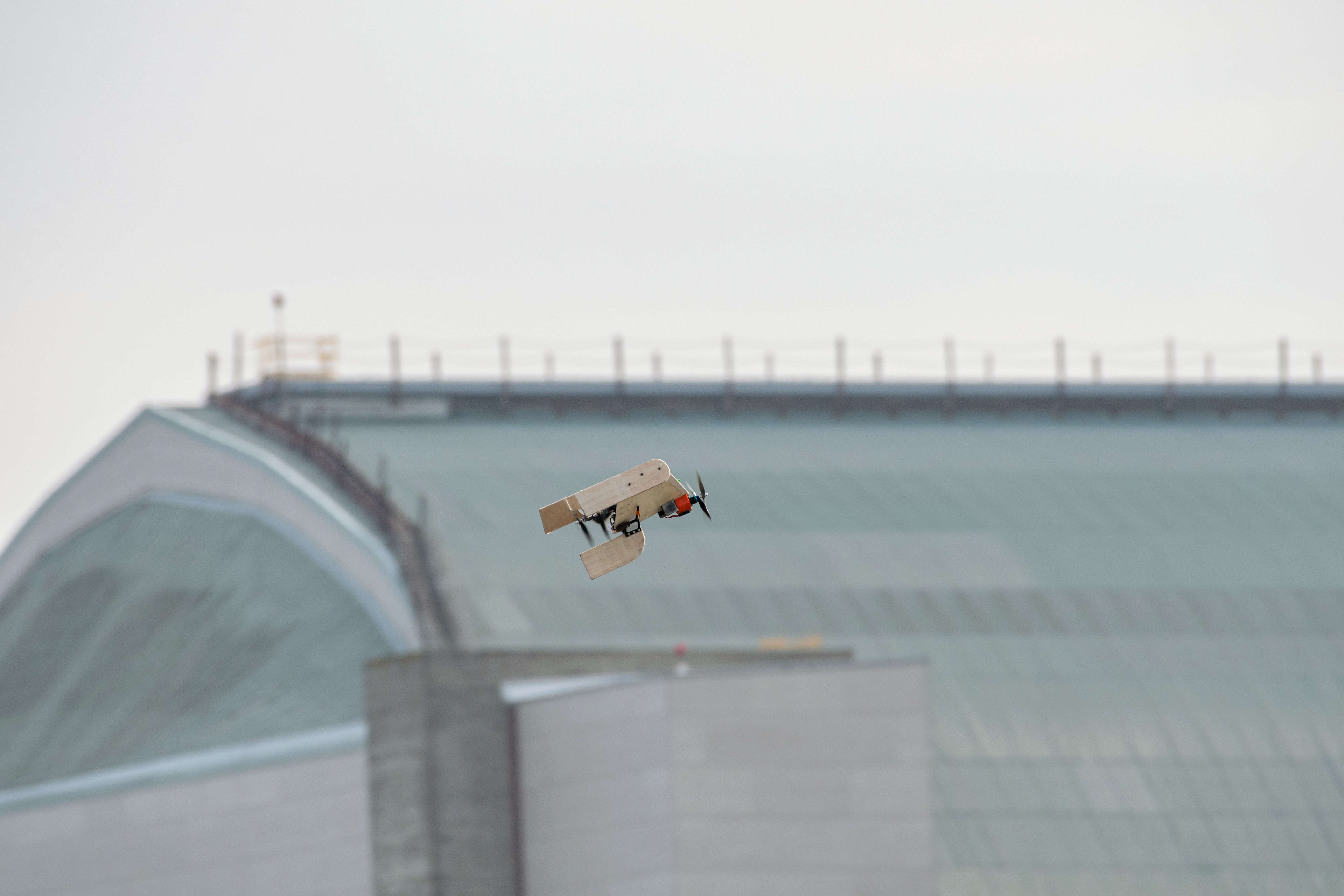 Against the backdrop of an airship hangar, the Jayu design transitions from vertical to horizontal flight.
