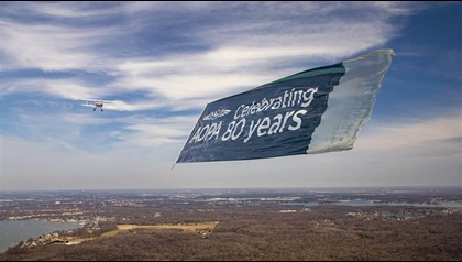 A billboard style banner in flight—a weighted fin at the front of the banner and netting at the back help it fly straight.