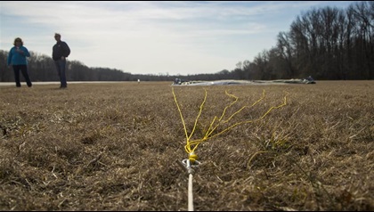 A tow rope connected with a metal O-ring to a banner ready for pickup.