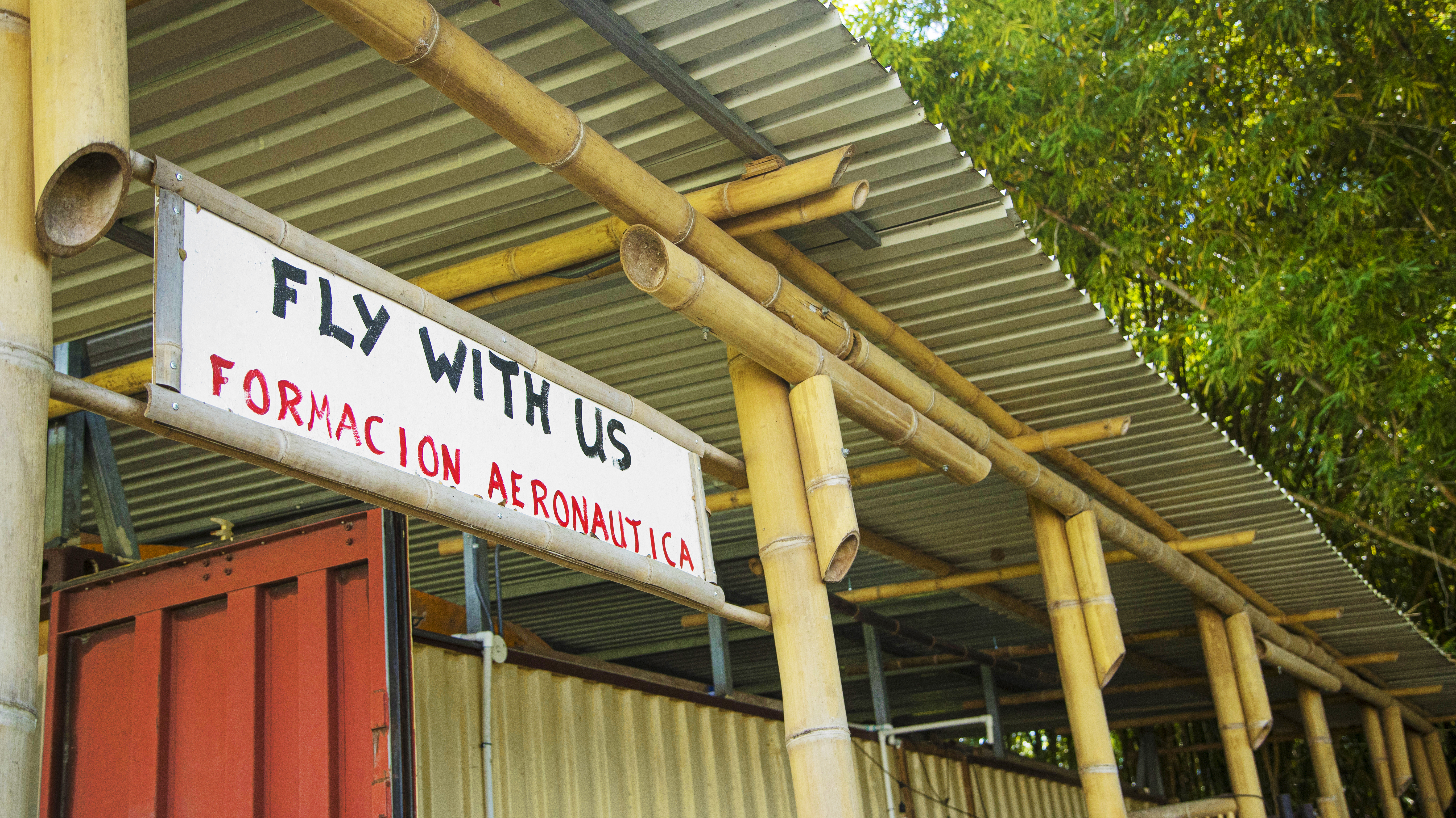 in the traditional sense, Fly With Us’ facility at the Aranjuez Aero Club houses the business, a small classroom, and an expansive porch.