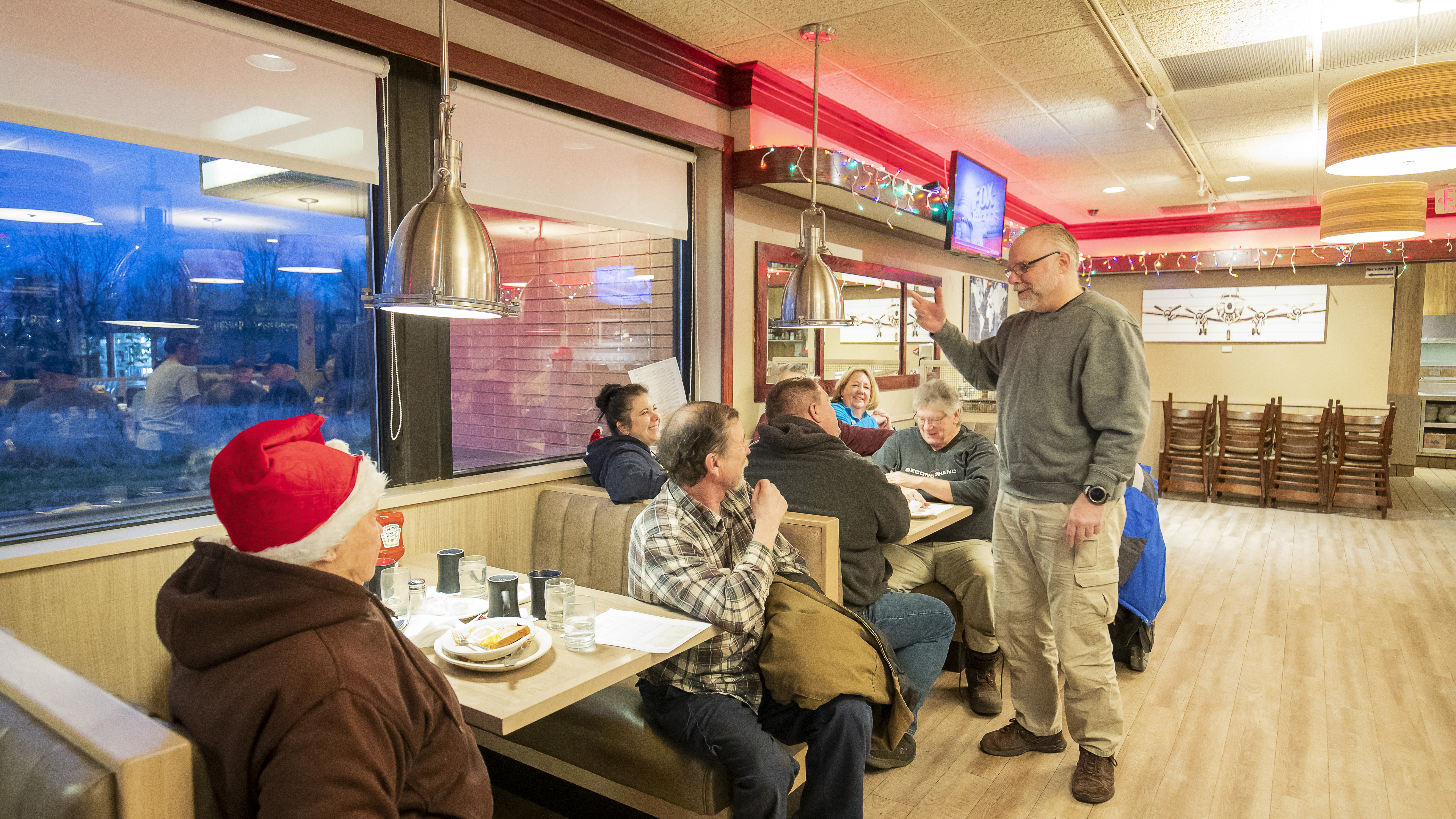 Volunteer coordinator Dean Greenblatt greets everyone early on Friday morning over coffee.