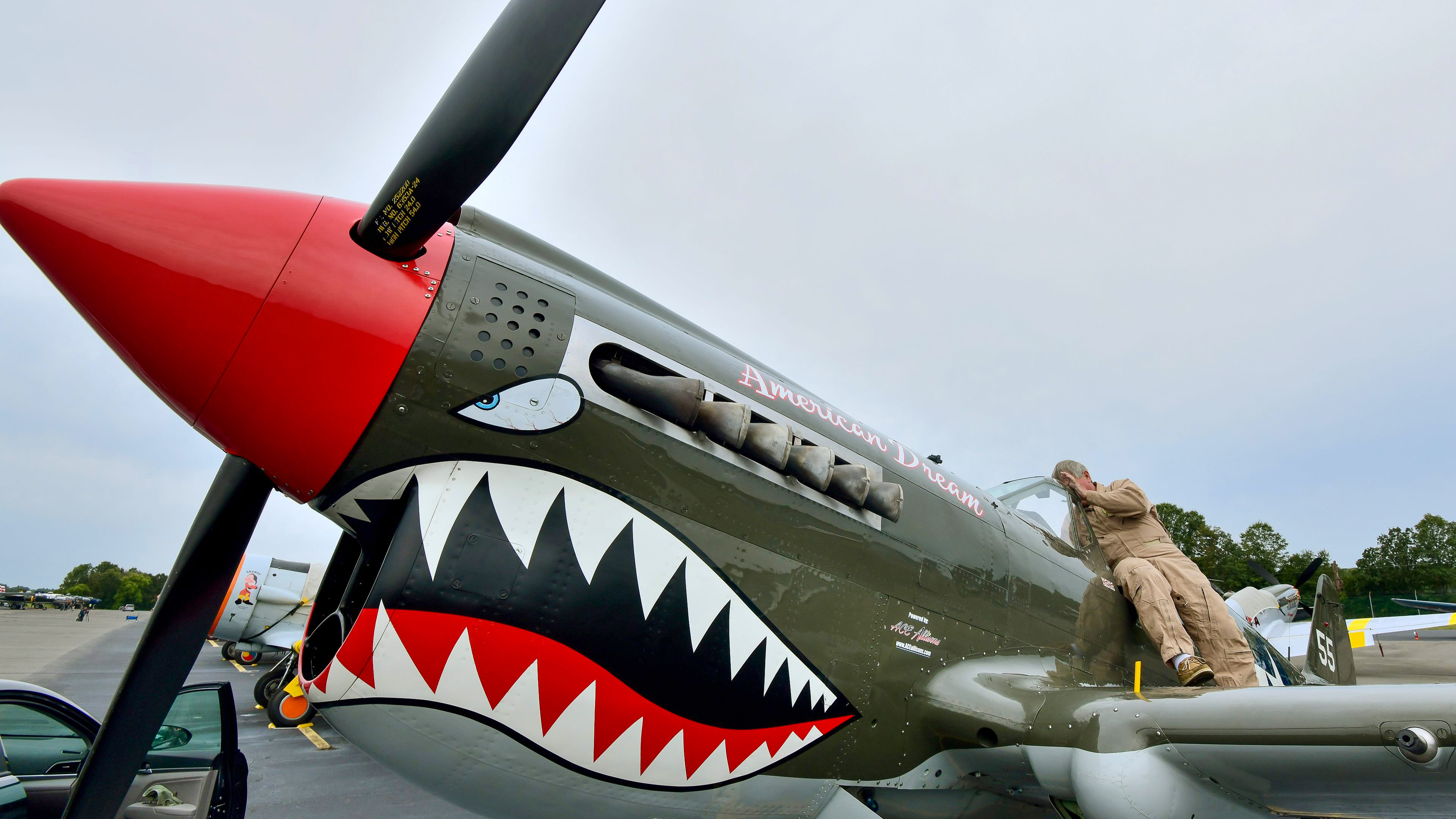 Russ Loggins  preflights a Curtiss P–40N.