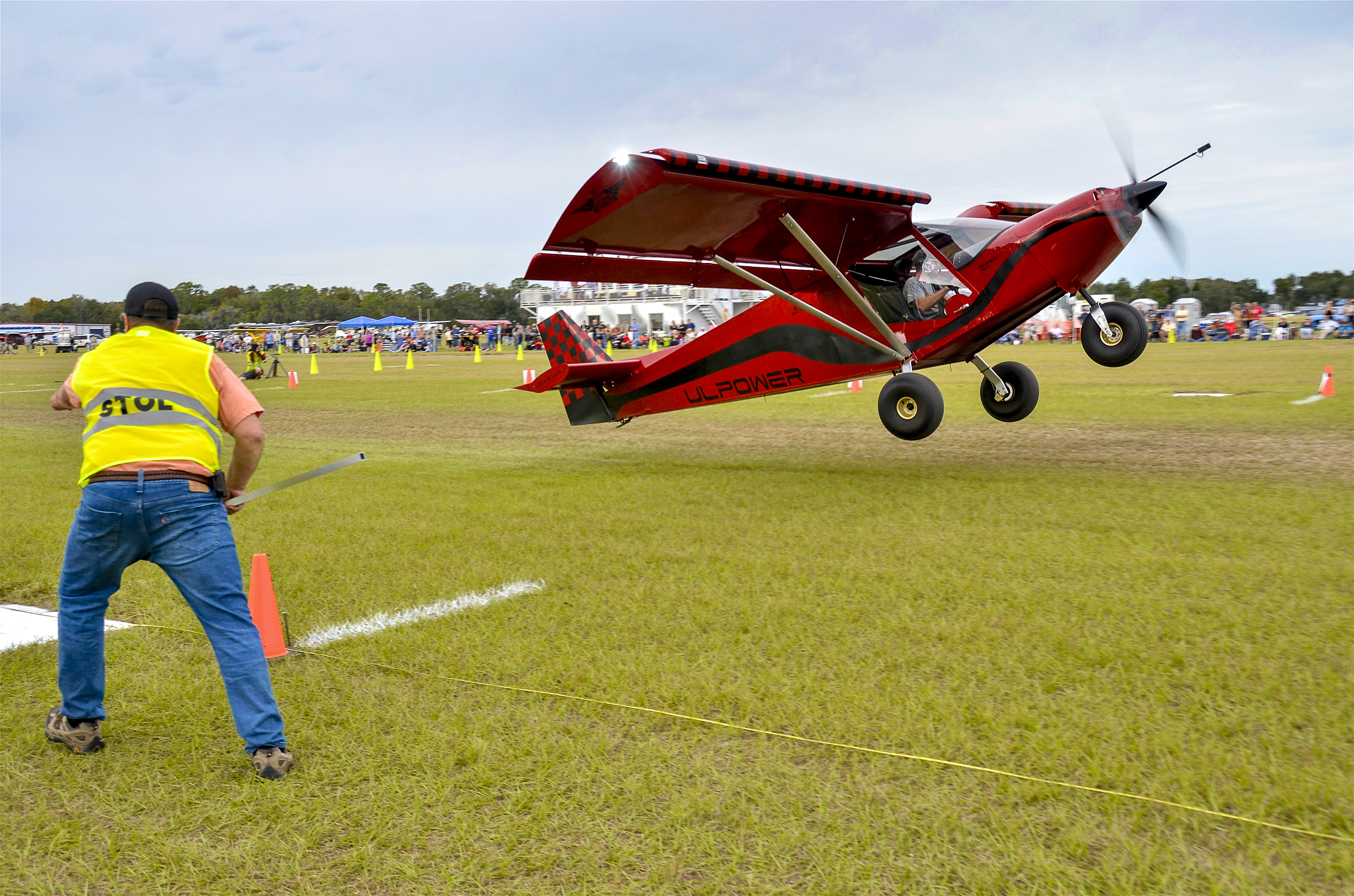 Jack Klein of Little Rock, Arkansas, marks Jon Humberd's takeoff spot; the Zenith STOL CH 701 was airborne in less than 75 feet. The demonstration of extreme aircraft performance capabilities thrilled hundreds of spectators throughout the two-day event.