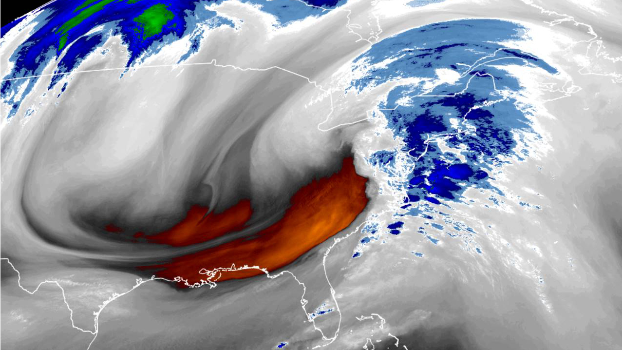 November 30 water vapor imagery from the GOES-16 satellite shows the three main flows around the winter system in the northeast. Warm air at high altitude (blue) shows the highest cloud tops. Gray clouds wrap around the central low, and orange identifies the dry air behind the cold front.