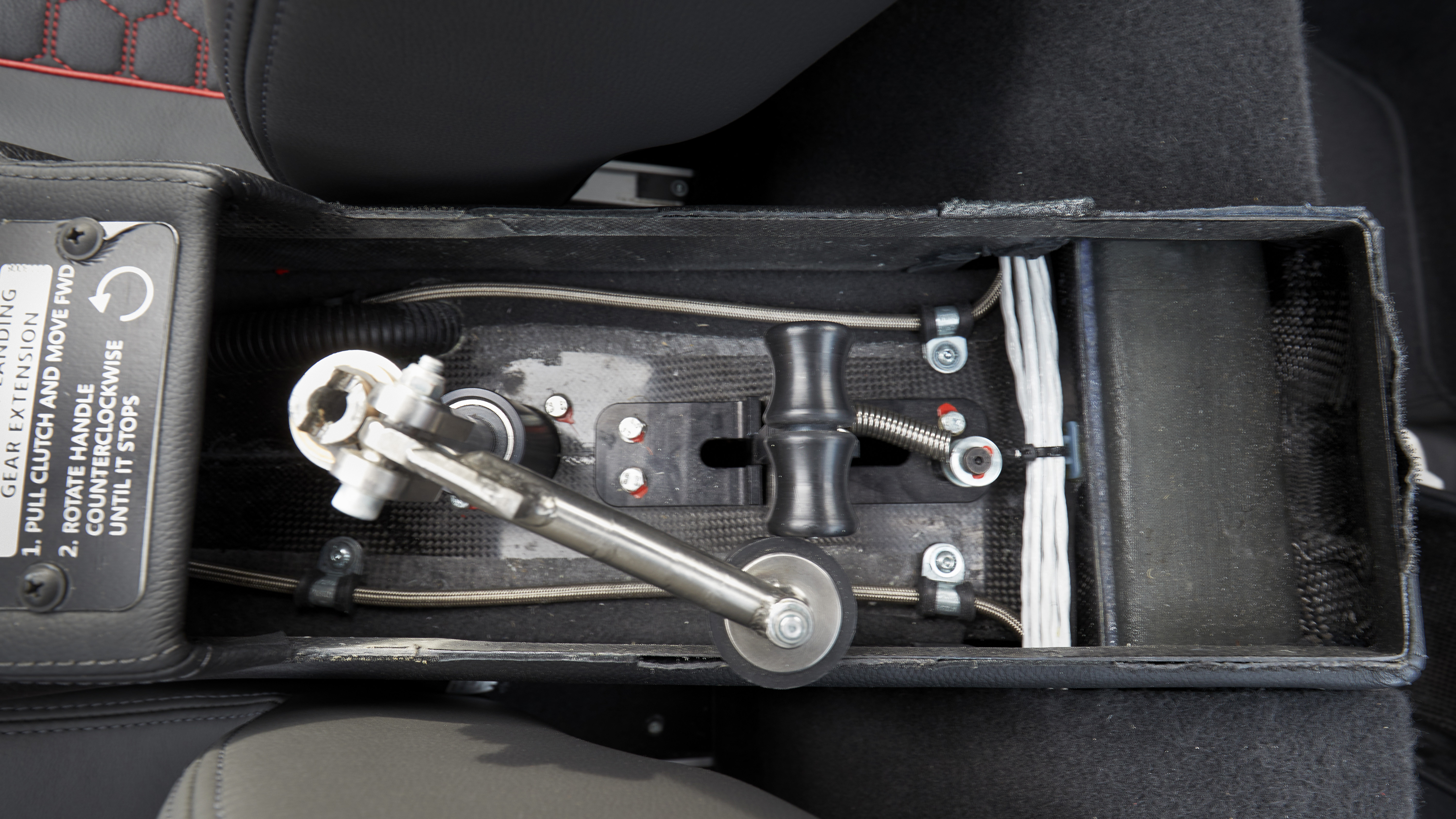 Emergency gear extension hand crank, located in a compartment in the center console.