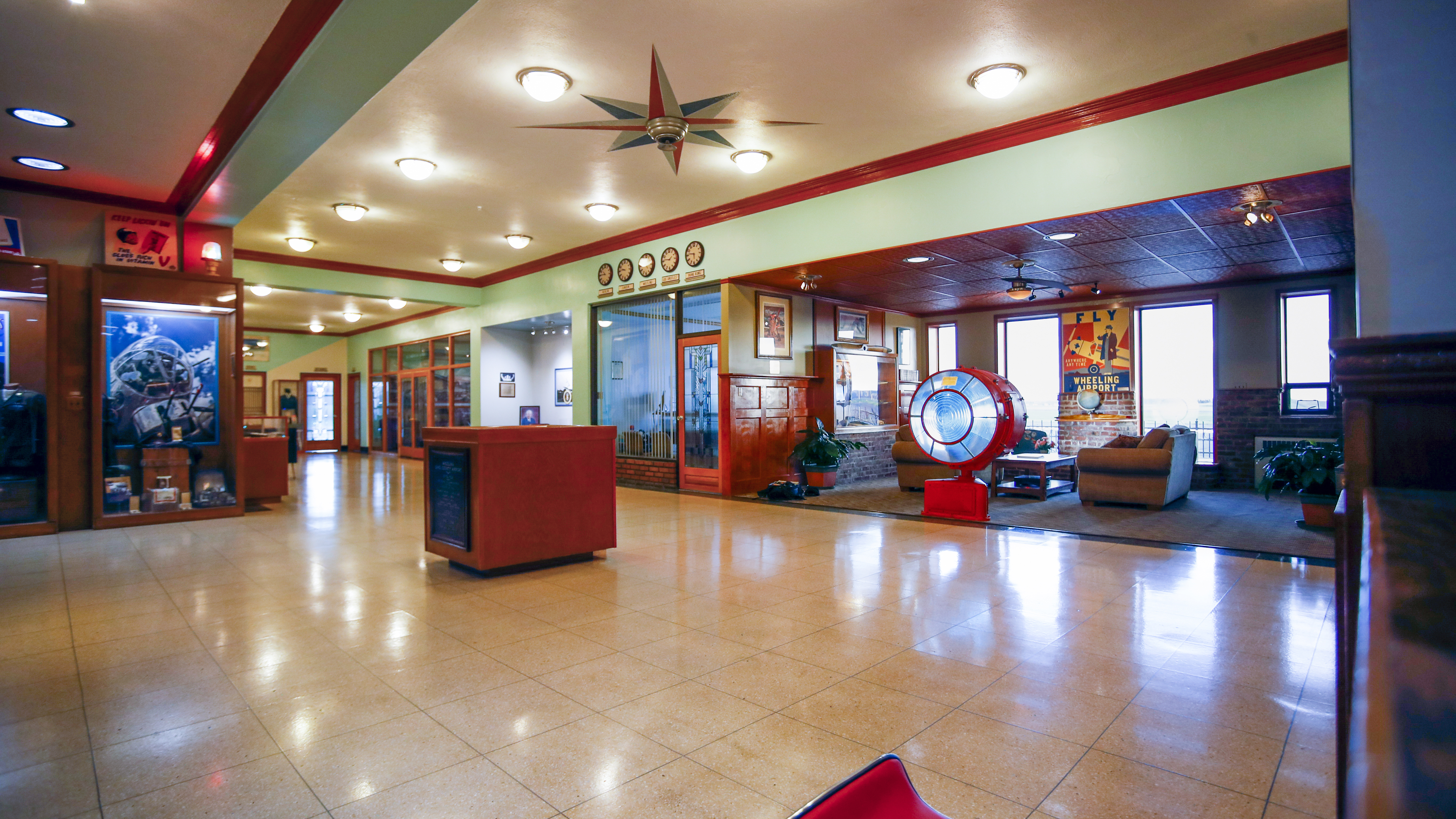 The terminal building lobby features numerous displays of artifacts from the airport’s history, while also providing comfortable seating for today’s waiting passengers.