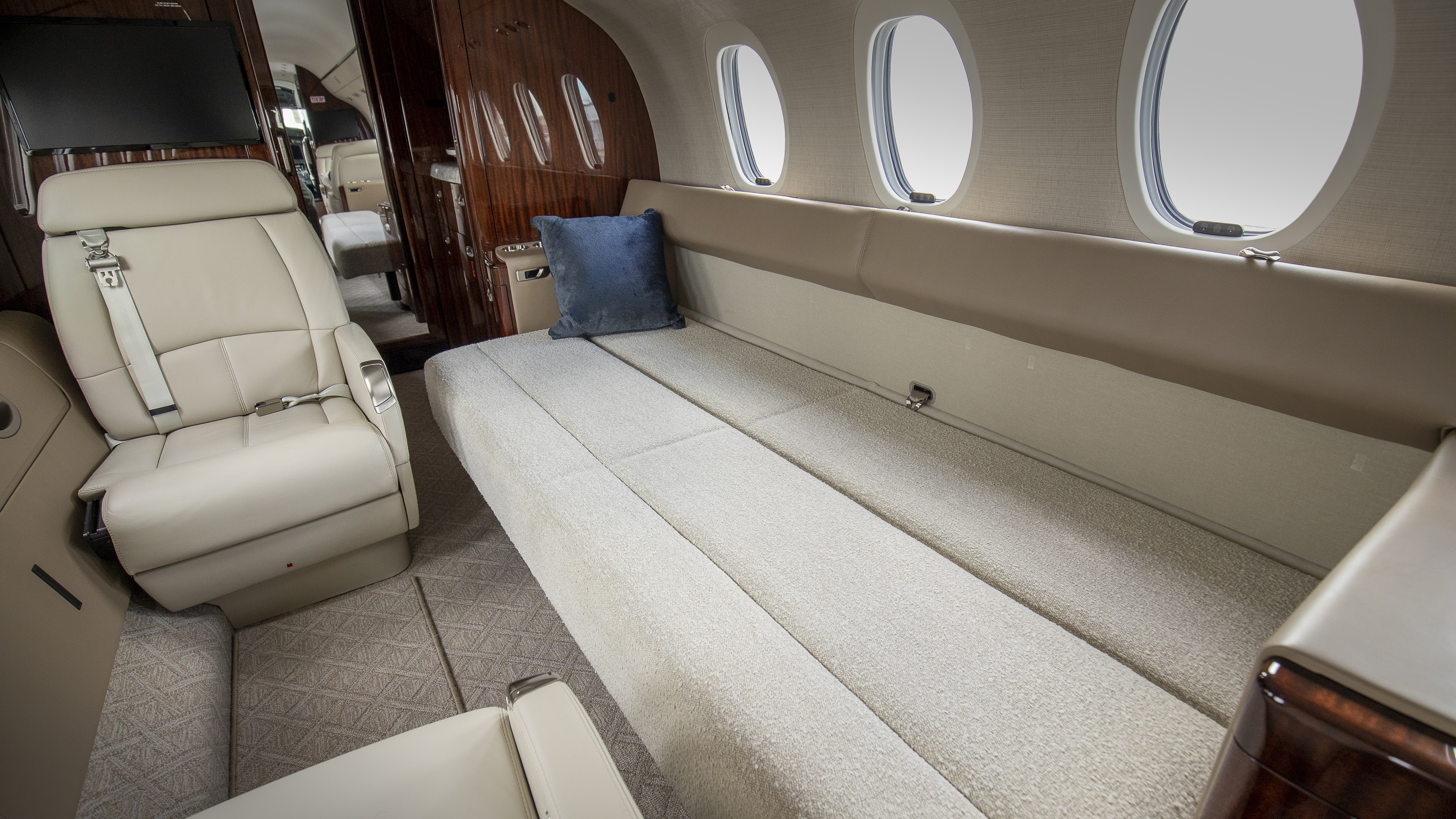 An aft, side-facing divan is one interior option, and its seat can be expanded to serve as a bed.