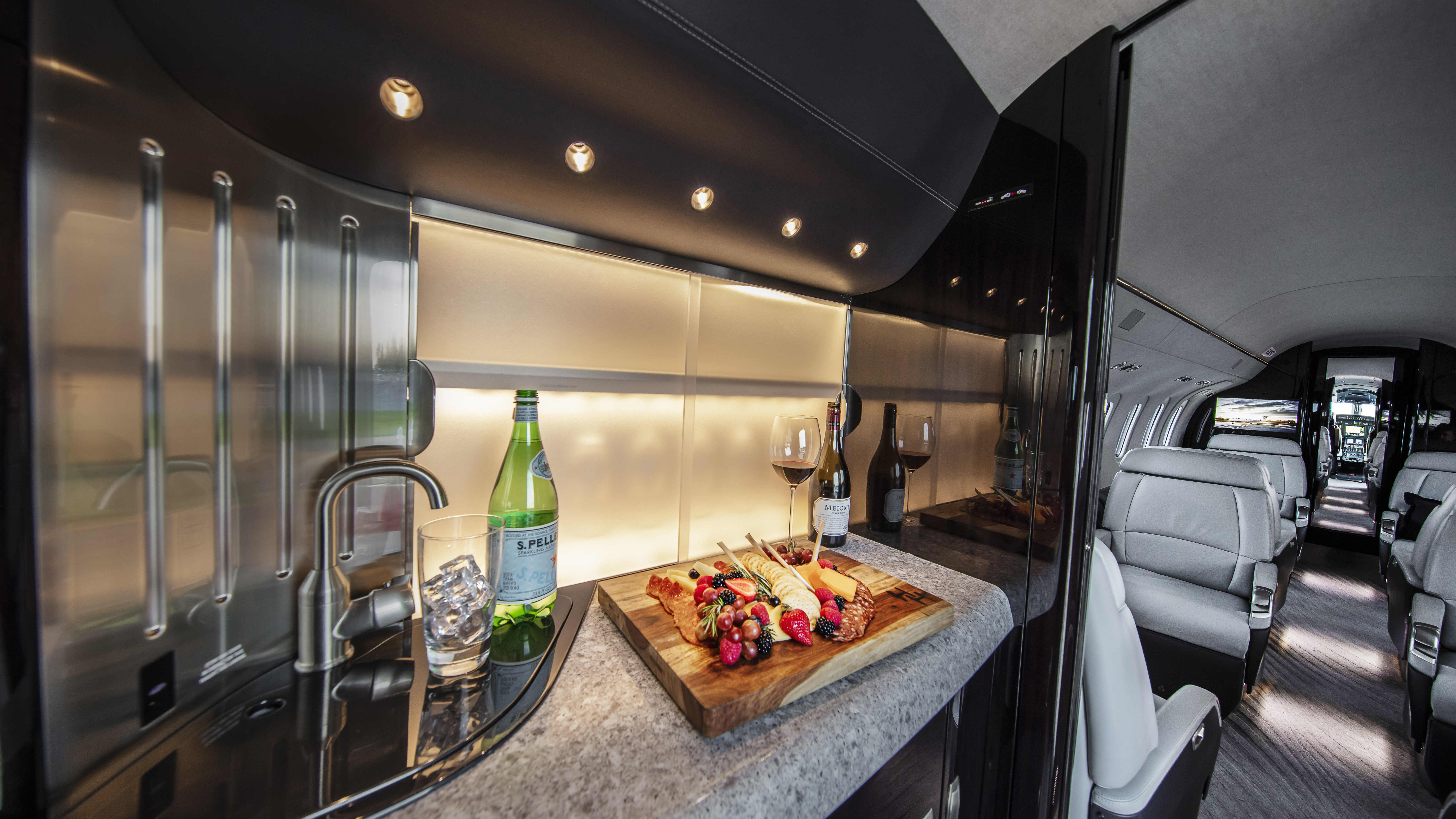 The galley includes ovens, a sink, and plenty of storage; ordering a forward, side-facing seat makes for a smaller galley space. (Courtesy Textron)