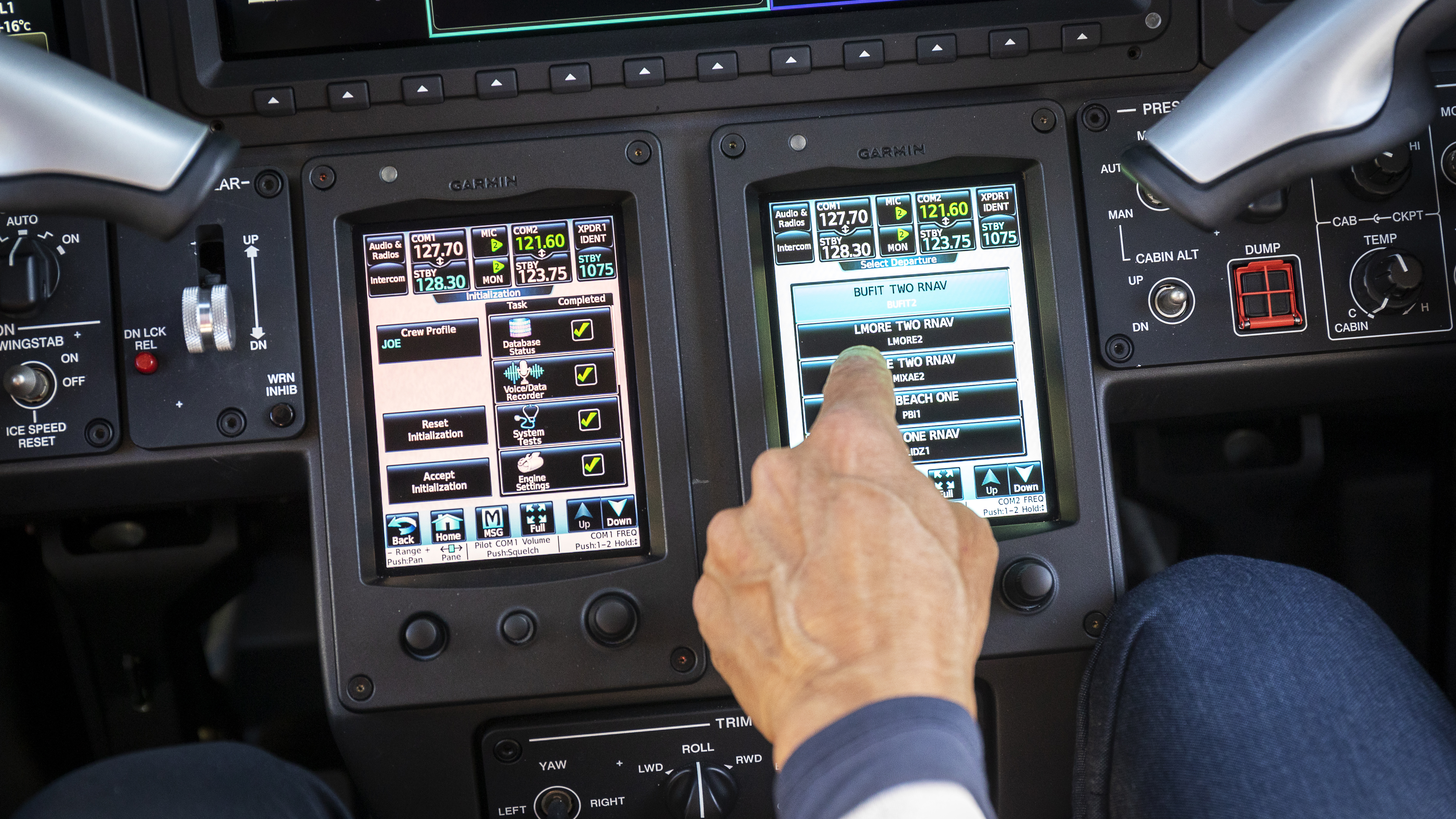 Howley enters data in the Phenom 300E’s touchscreen controllers.