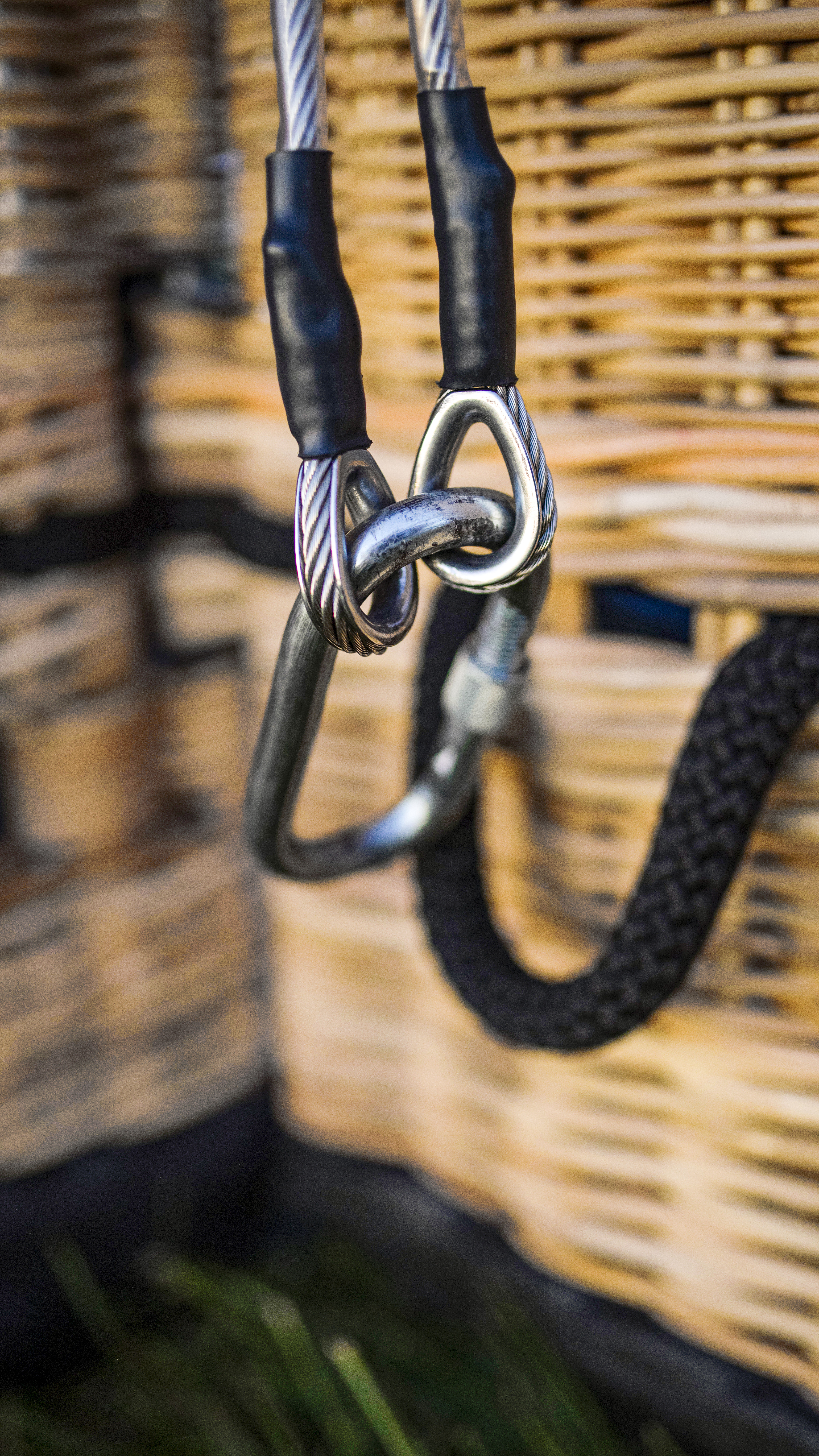 A carabiner holds envelope support cables in place.