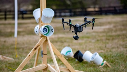 Another view of the obstructed lane. The apparatus is built with common lumber and buckets of various sizes that can also contain images of objects of interest, such as weapons, hazardous materials placards, or anything the user might want to practice finding. Buckets can be placed in vehicles, open fields, or buildings to create more elaborate and mission-specific training scenarios.