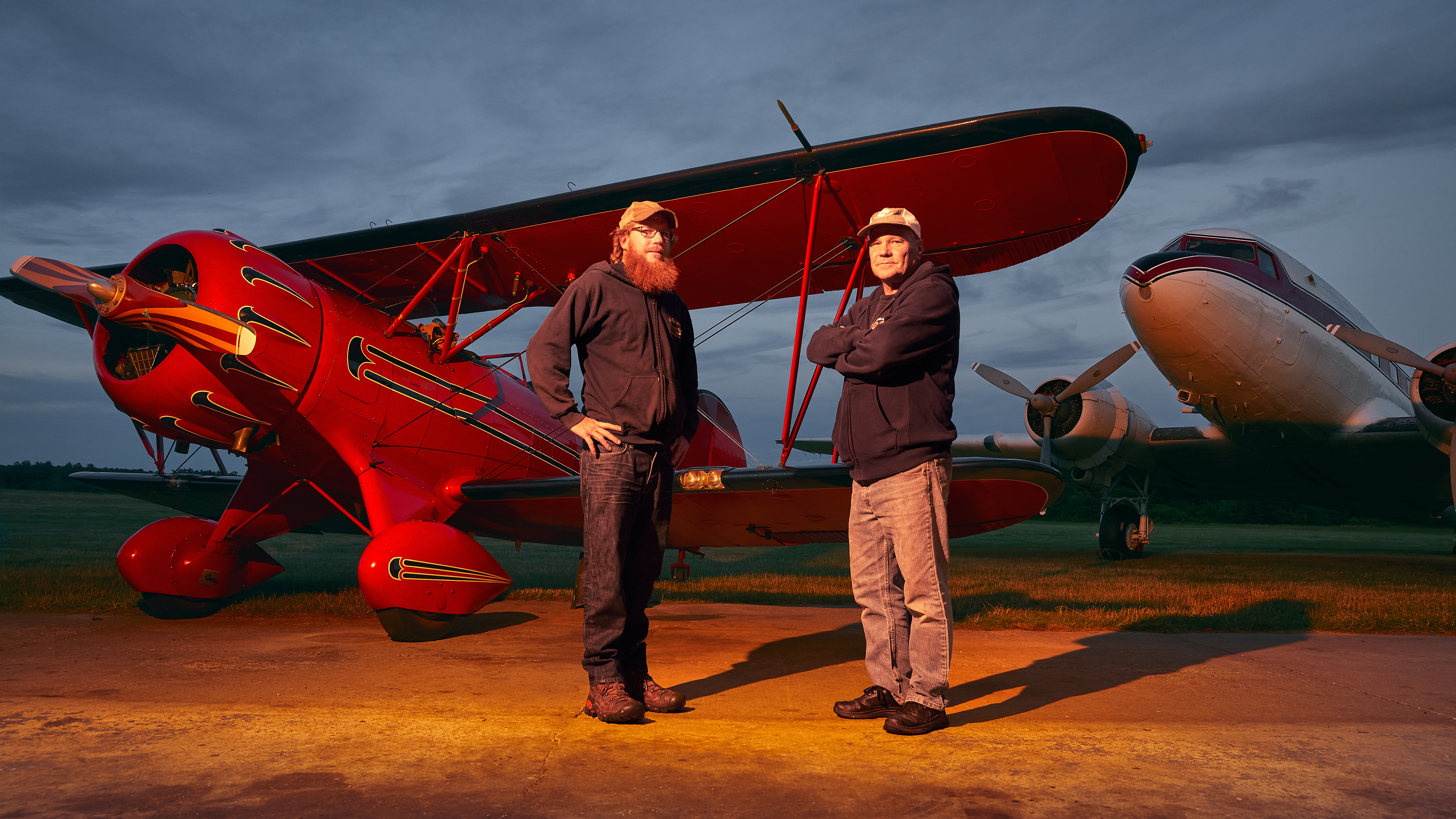 Christopher and Chris “Sid” Siderwicz with one of the Waco biplanes they use for sightseeing Cape Cod and the islands. Photograph by Caroline Brodt.