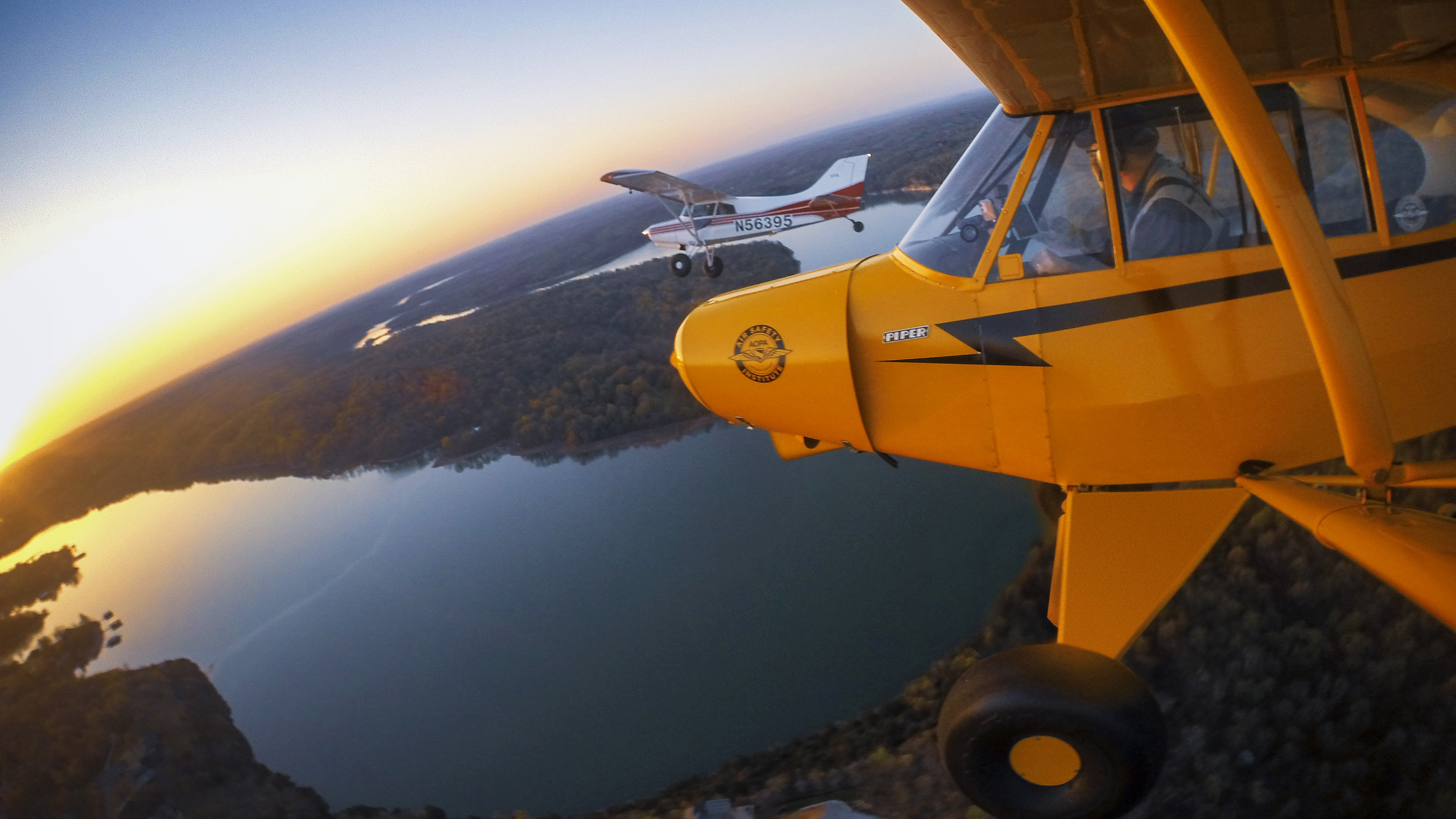 An Ozarks sunrise. Smooth air  and clear skies make for easy formation flying with Chip Gibbons’ Maule. Photography by Mike Fizer.