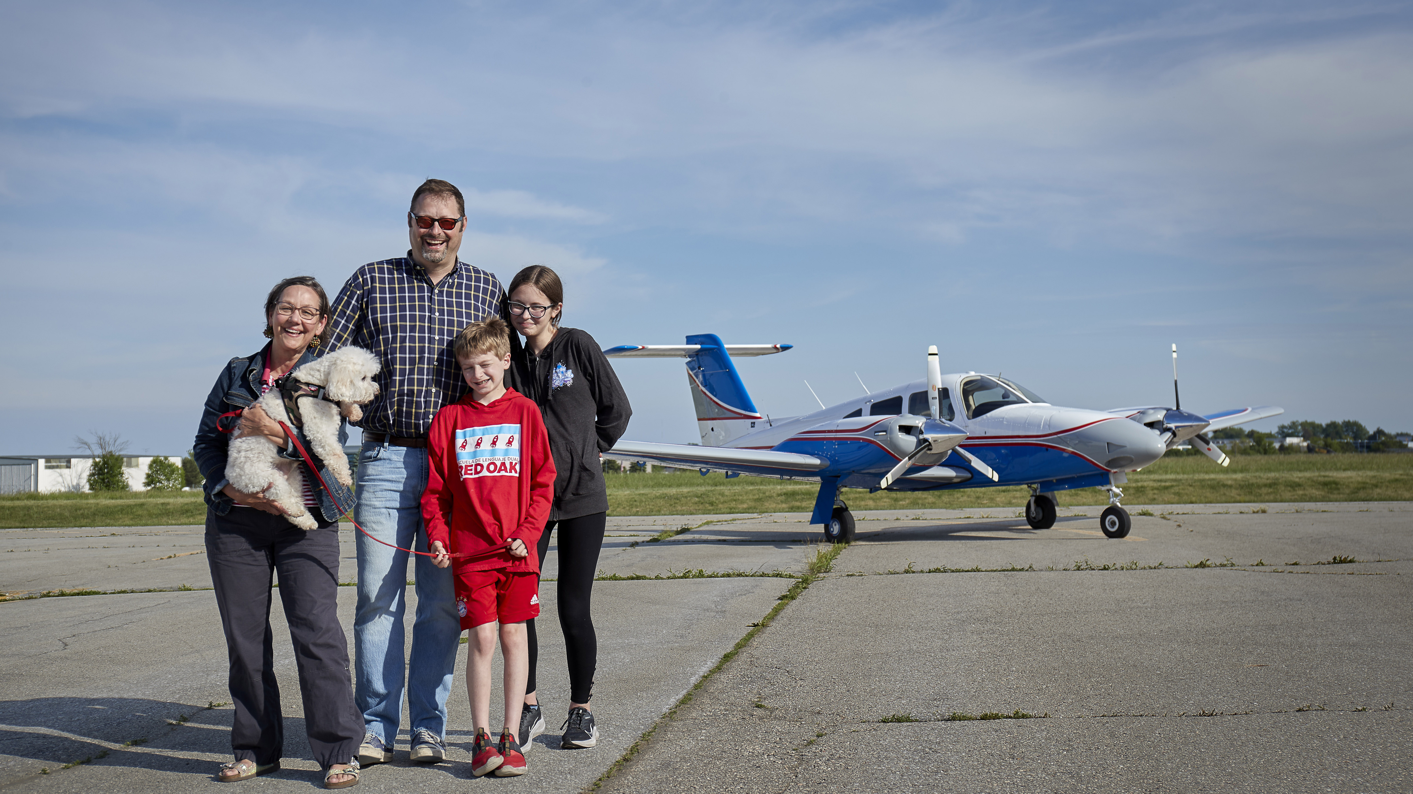 Coleman poses on the Kenosha ramp with wife Julie, dog Lucky, son Ben, and daughter Naomi.