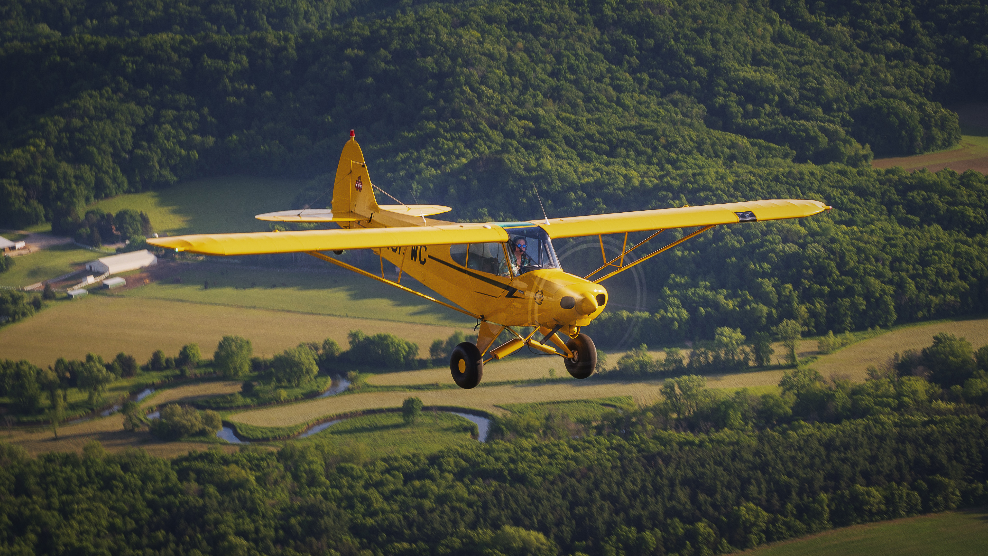 Flying low and slow over farm fields—as a Super Cub should.
