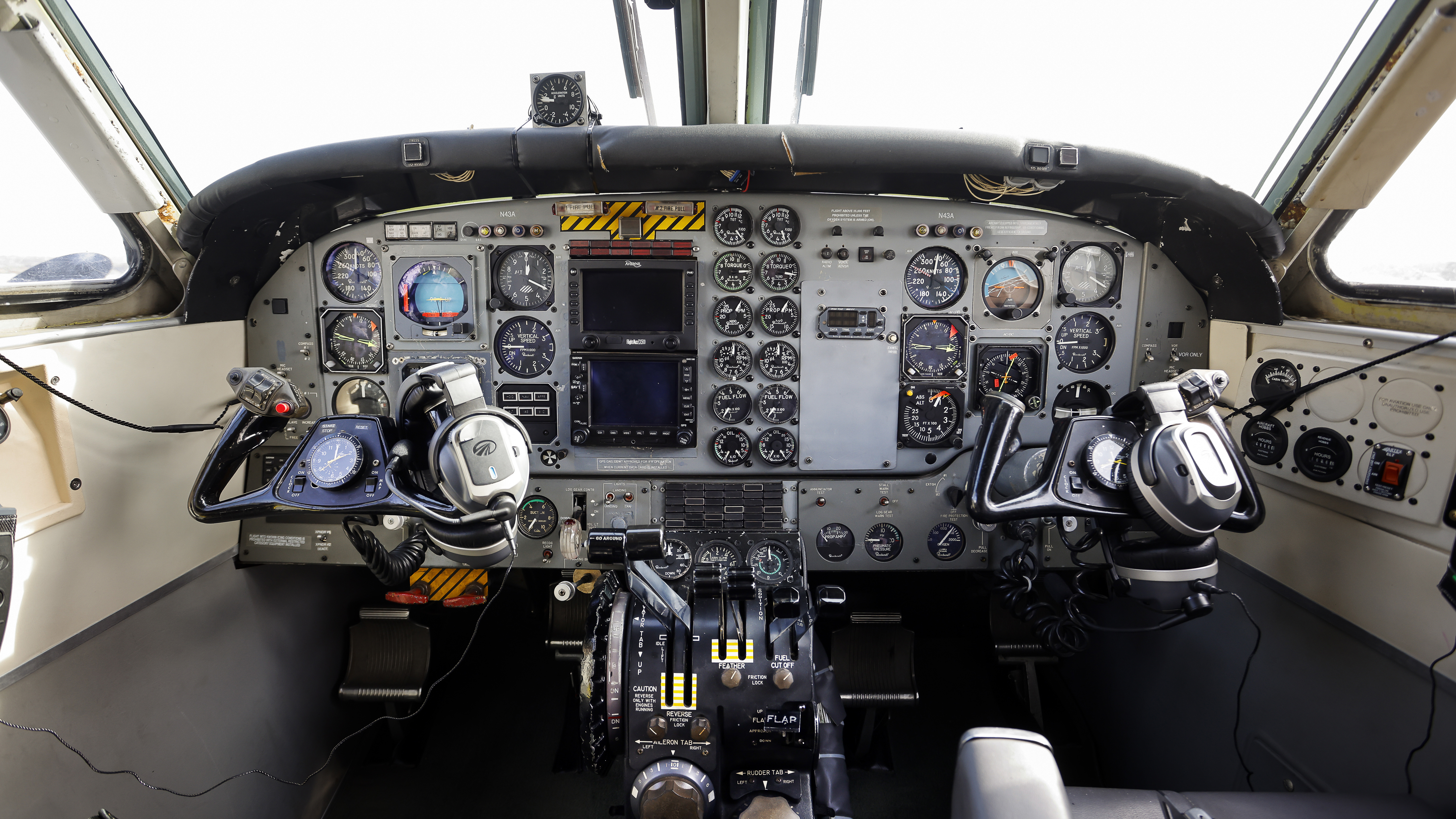 Black and yellow stripes highlight the location of the two engine fire extinguisher T-handles.