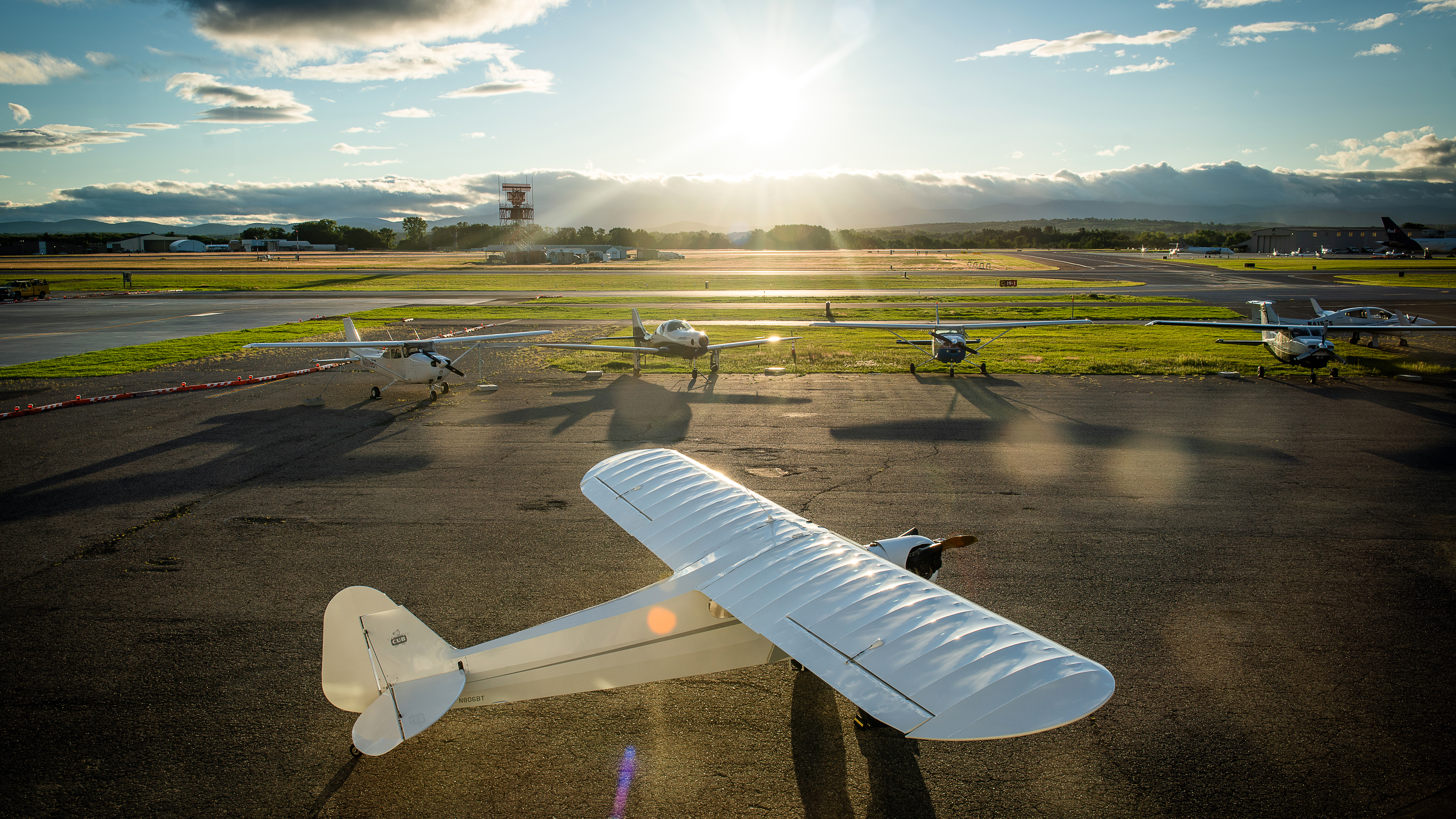 The sun rises on Burlington International Airport in Vermont, where several Beta Technologies aircraft await exercise by the many pilots on staff.