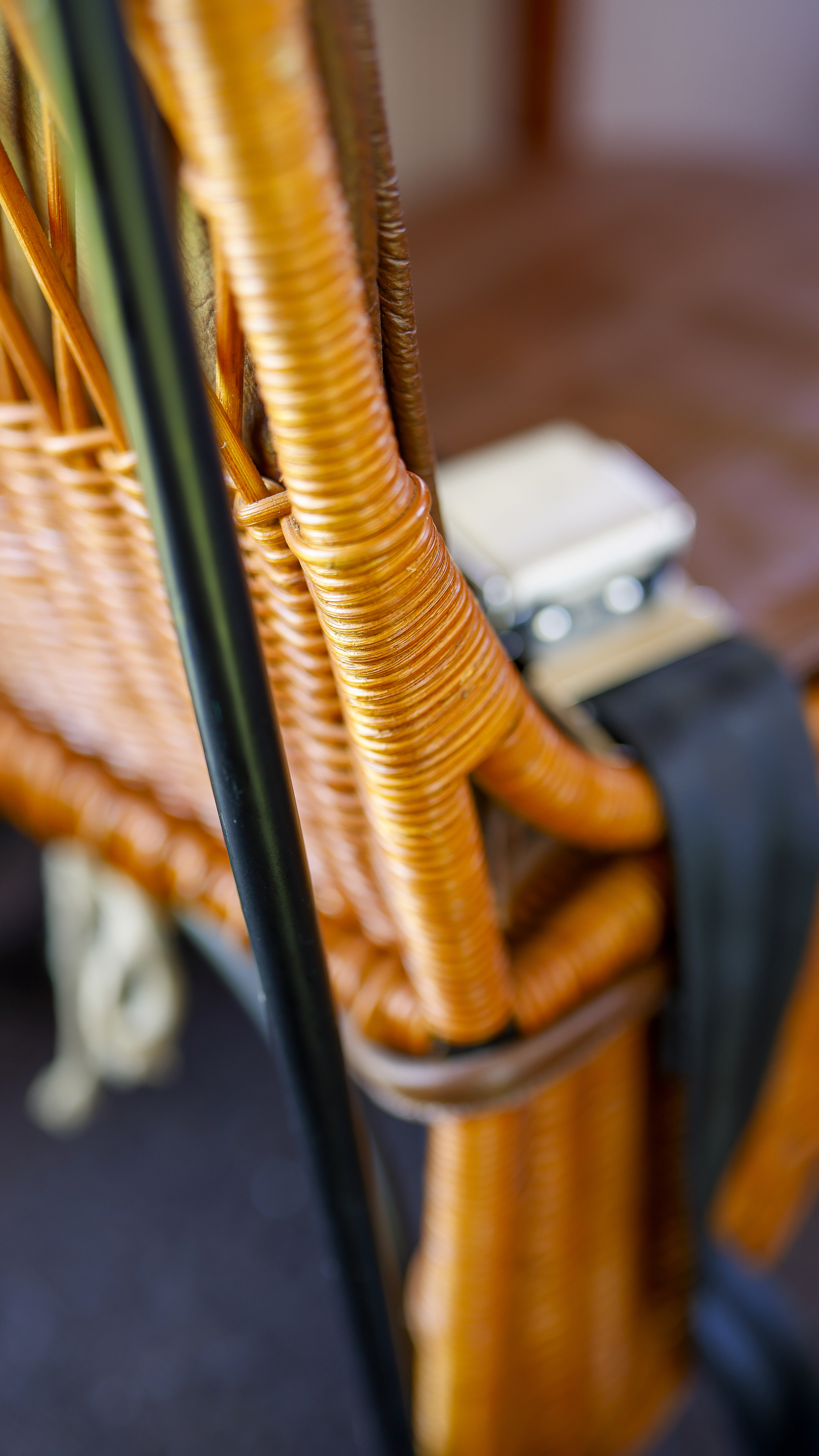 The wicker seat was painstakingly recreated with the help of a local basket weaver, and the leather covers were stitched by hand.