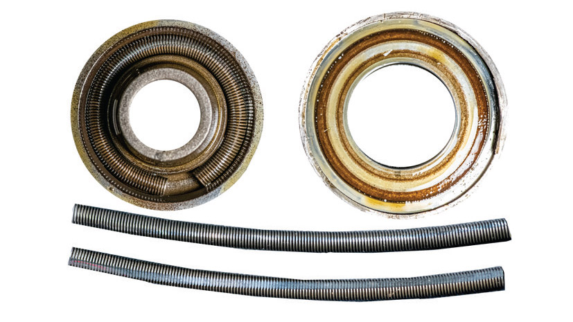 Continental rotocoil disassembled, showing the garter spring(top). Two garter springs, one in good shape, the other badly worn (bottom).