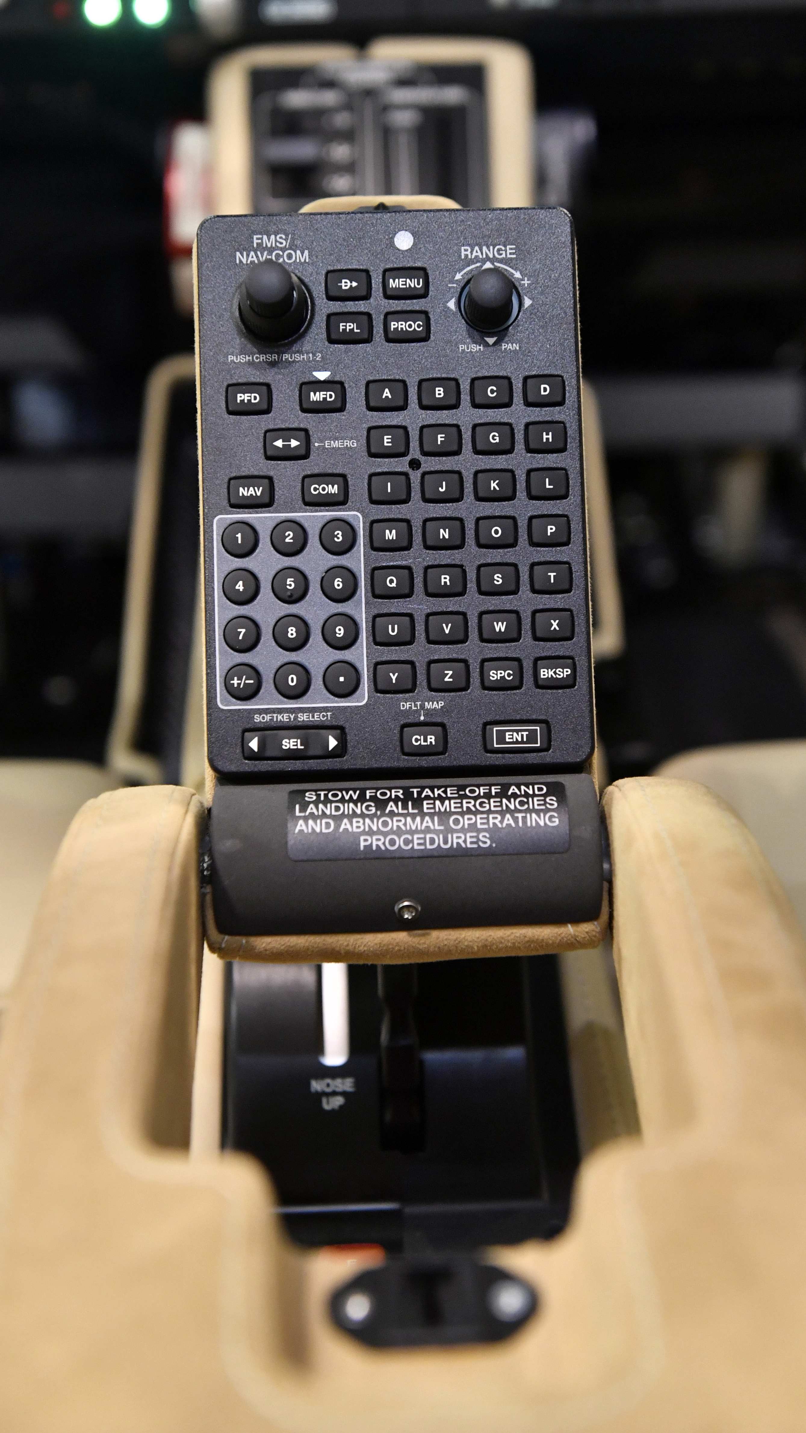 The arm rest contains flip-up multifunction display and other controls for easy access.