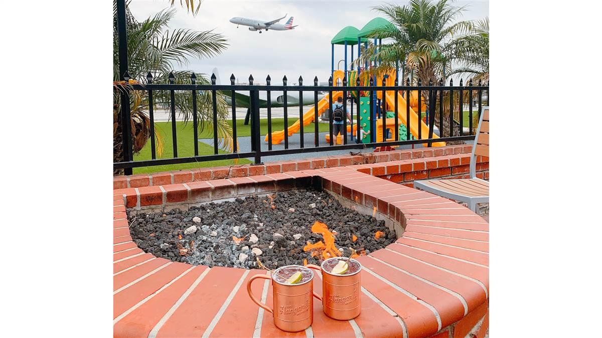 Watch aircraft on short final from the outside bar at The Proud Bird restaurant near Los Angeles International Airport.