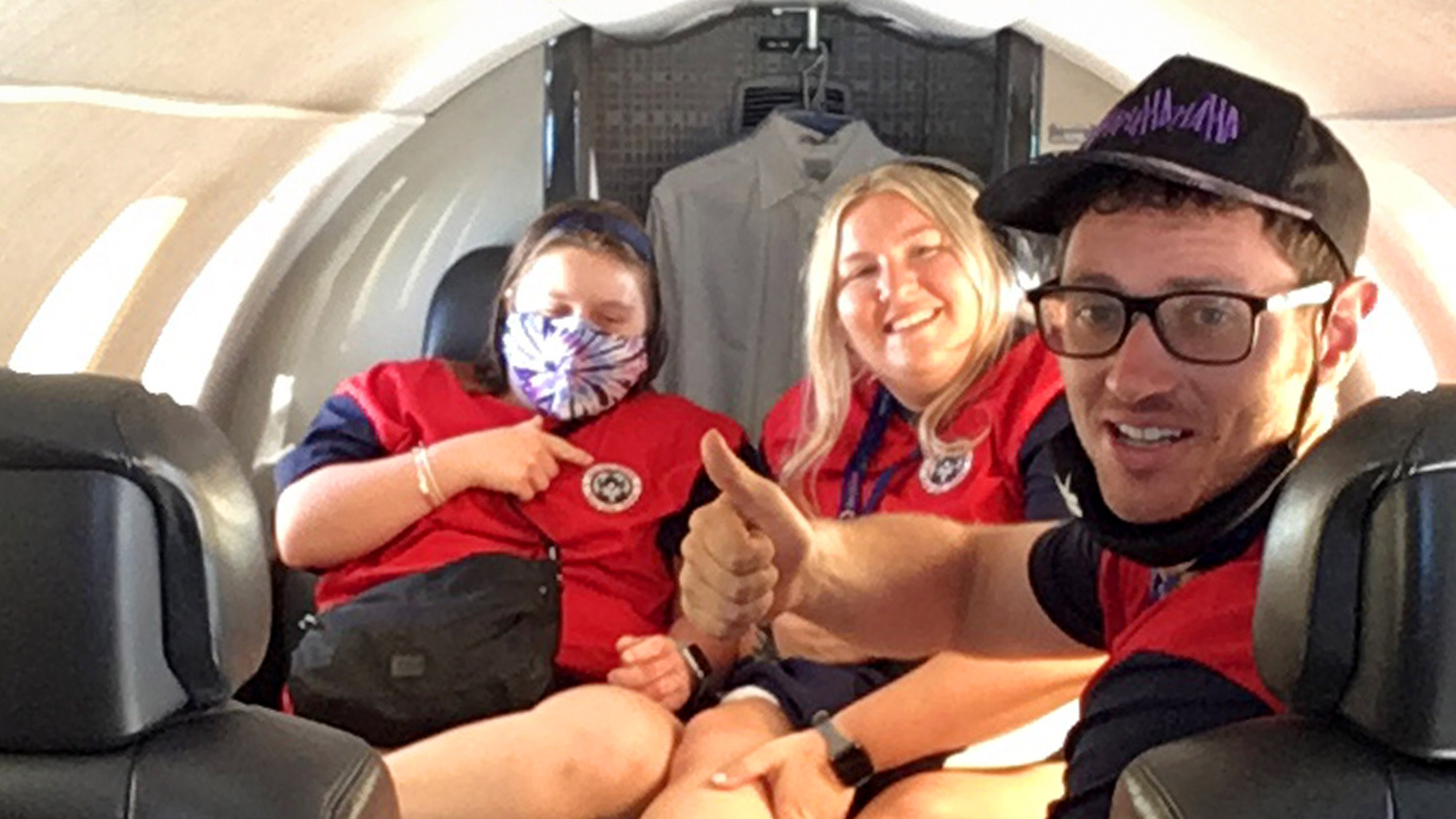 Alexa Akin and Brian Beirne flank their coach Amanda Berdorf in the Citation M2.