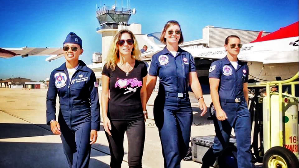 I Hart Flying founder Rachelle Spector with U.S. Air Force Thunderbirds Capt. Kassandra Mangosing, Master Sgt. Christine Powers, and Staff Sgt. Kristyne Pierson.