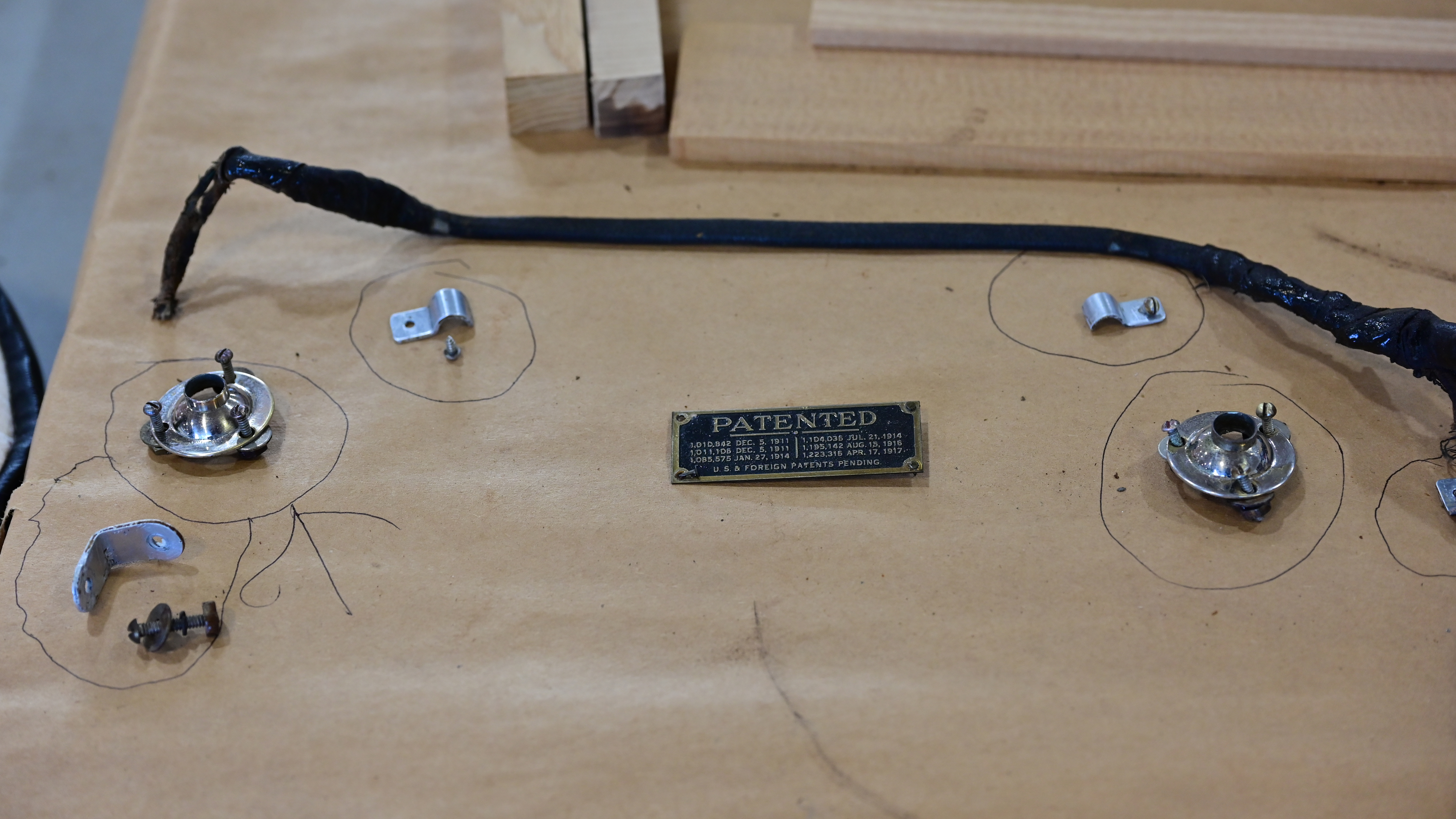 Circled parts are the rear instrument panel original hardware with electrical wires that go to the cockpit lamps.