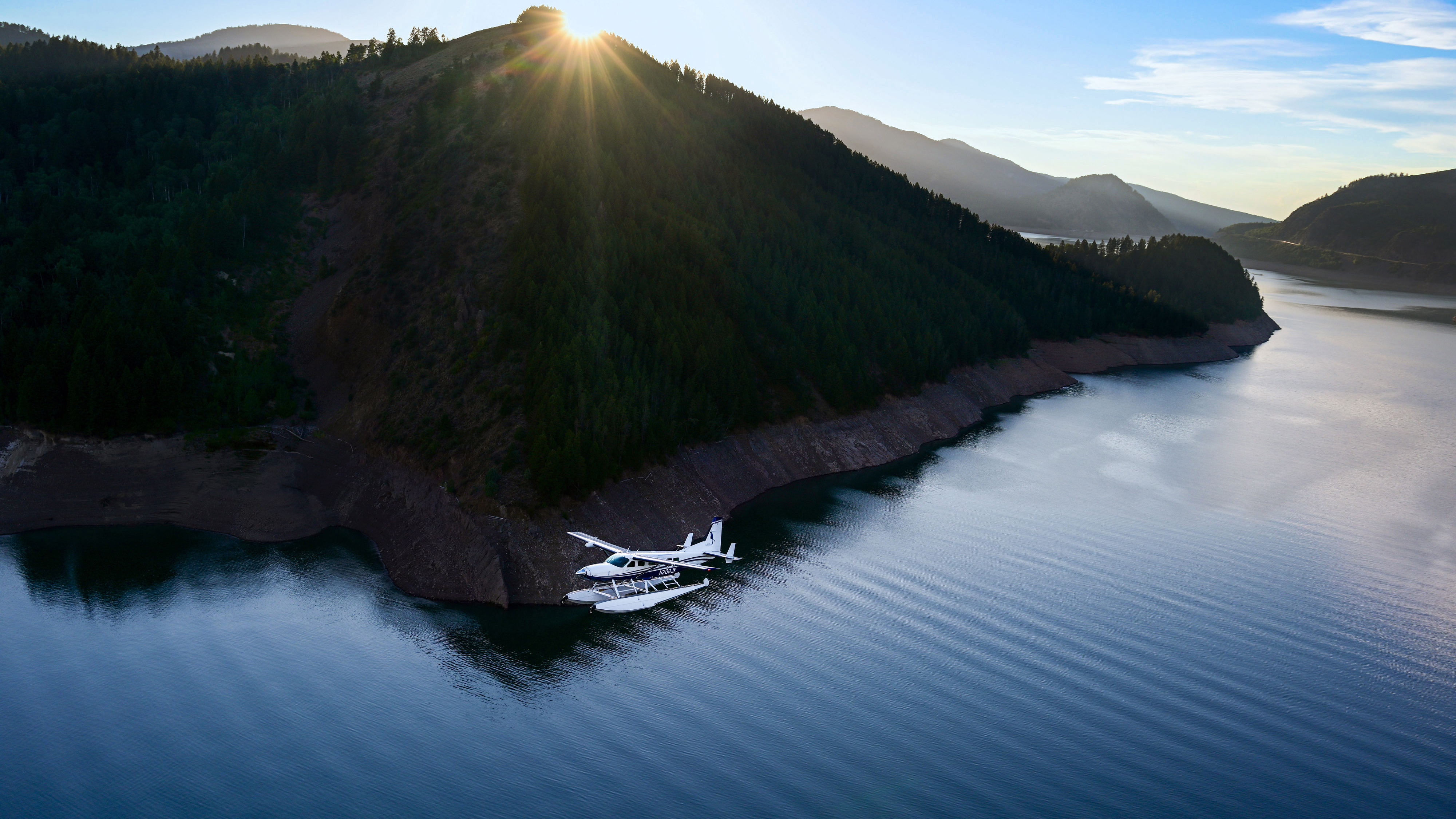 The float Caravan can handle ocean swells or high mountain lakes like the one pictured here in Wyoming. Amphibious floats transform the no-frills cargo hauler to an all-surface adventure machine.