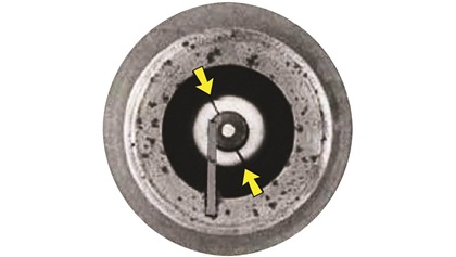 Champion RHB32S fine-wire spark plug with cracked nose core insulator.