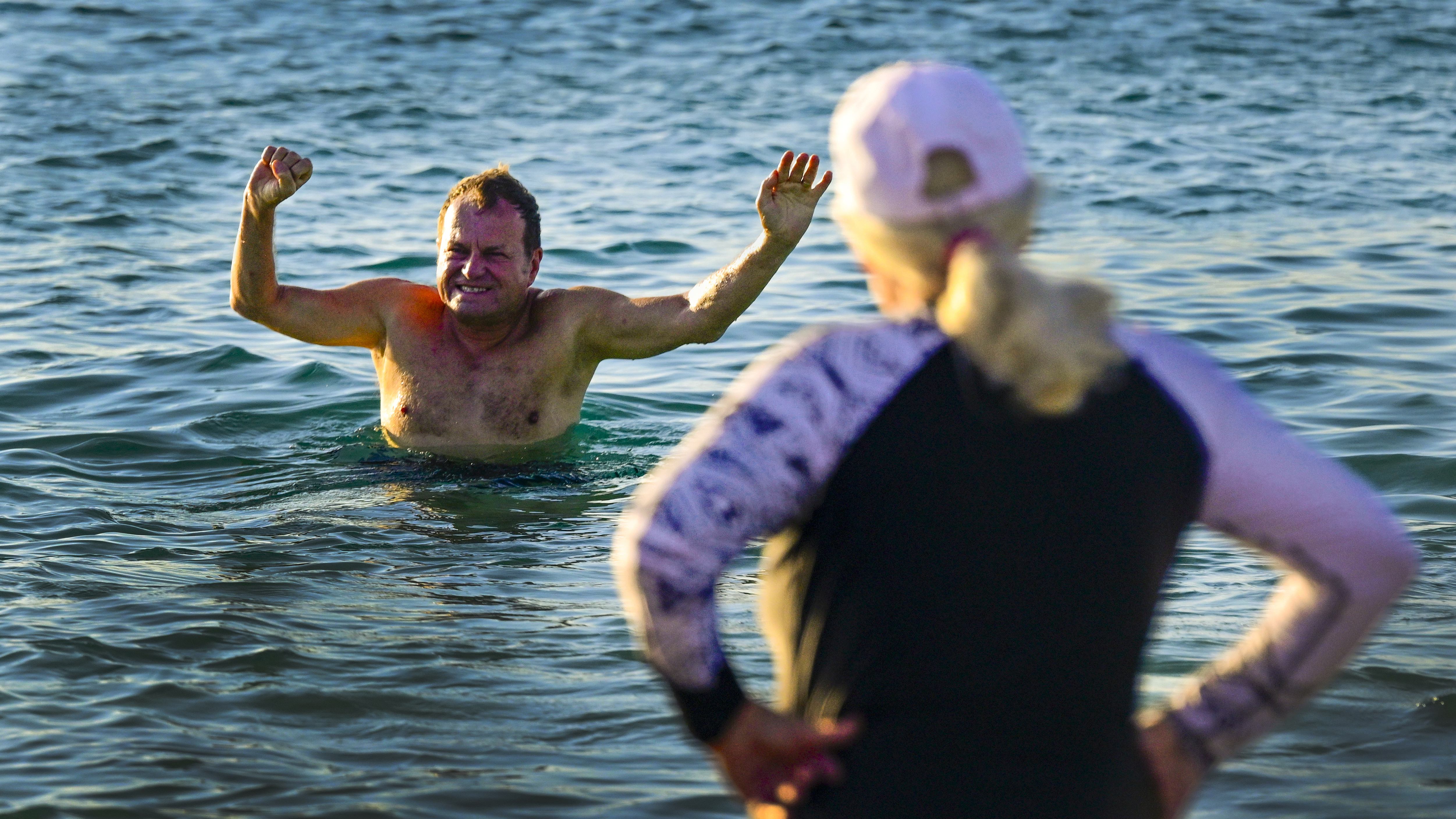 Bob Kocher reacts to a plunge in the ocean. The Galápagos may be very near the equator, but cold ocean currents keep water temperatures on the cool side.