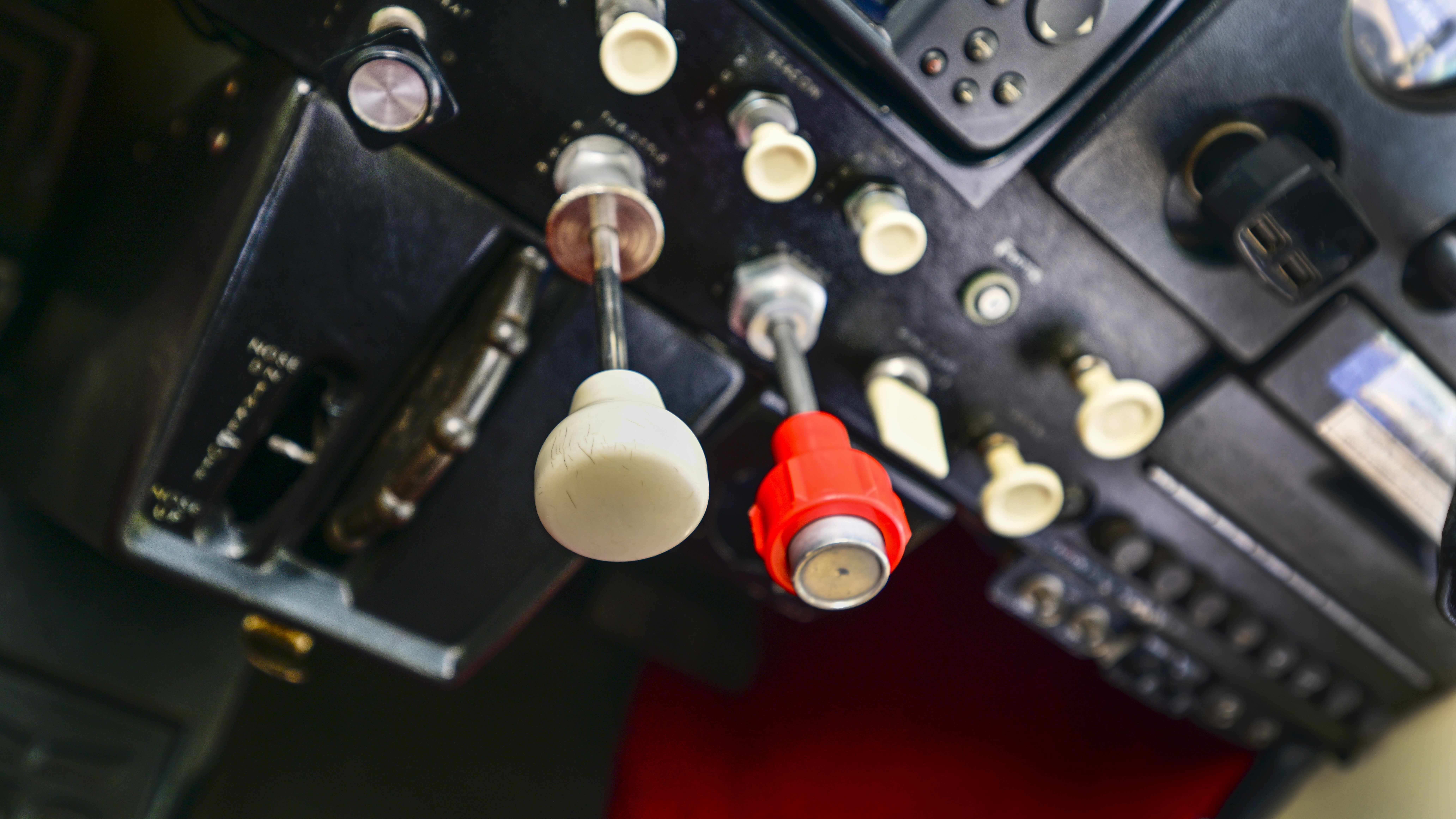 Basic throttle and mixture controls manage a rebuilt Continental O-200A engine.